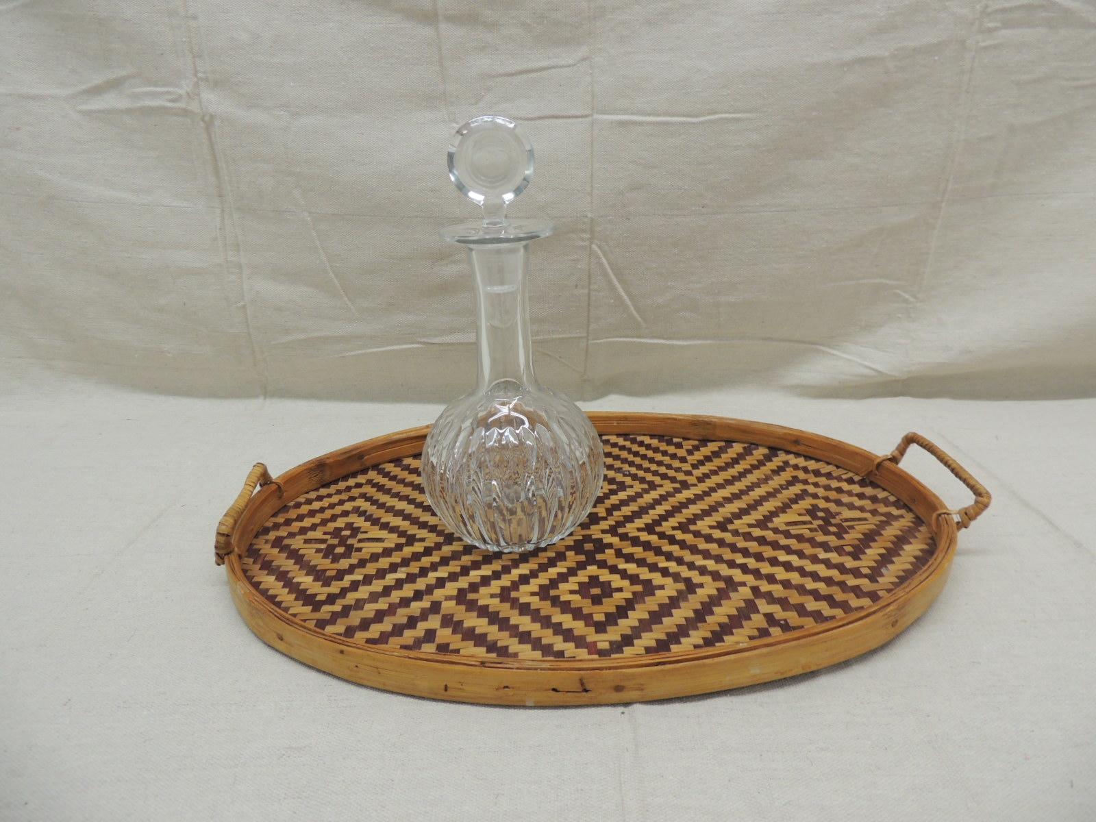 Vintage oval rattan and bamboo serving tray with handles
Woven brown and tan diamond pattern
Size: 17.5 x 12.5 x 2 H (to the top of the handle).
