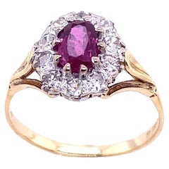Vintage Oval Ruby 
Diamond Cluster Ring in 18ct Yellow 
White Gold