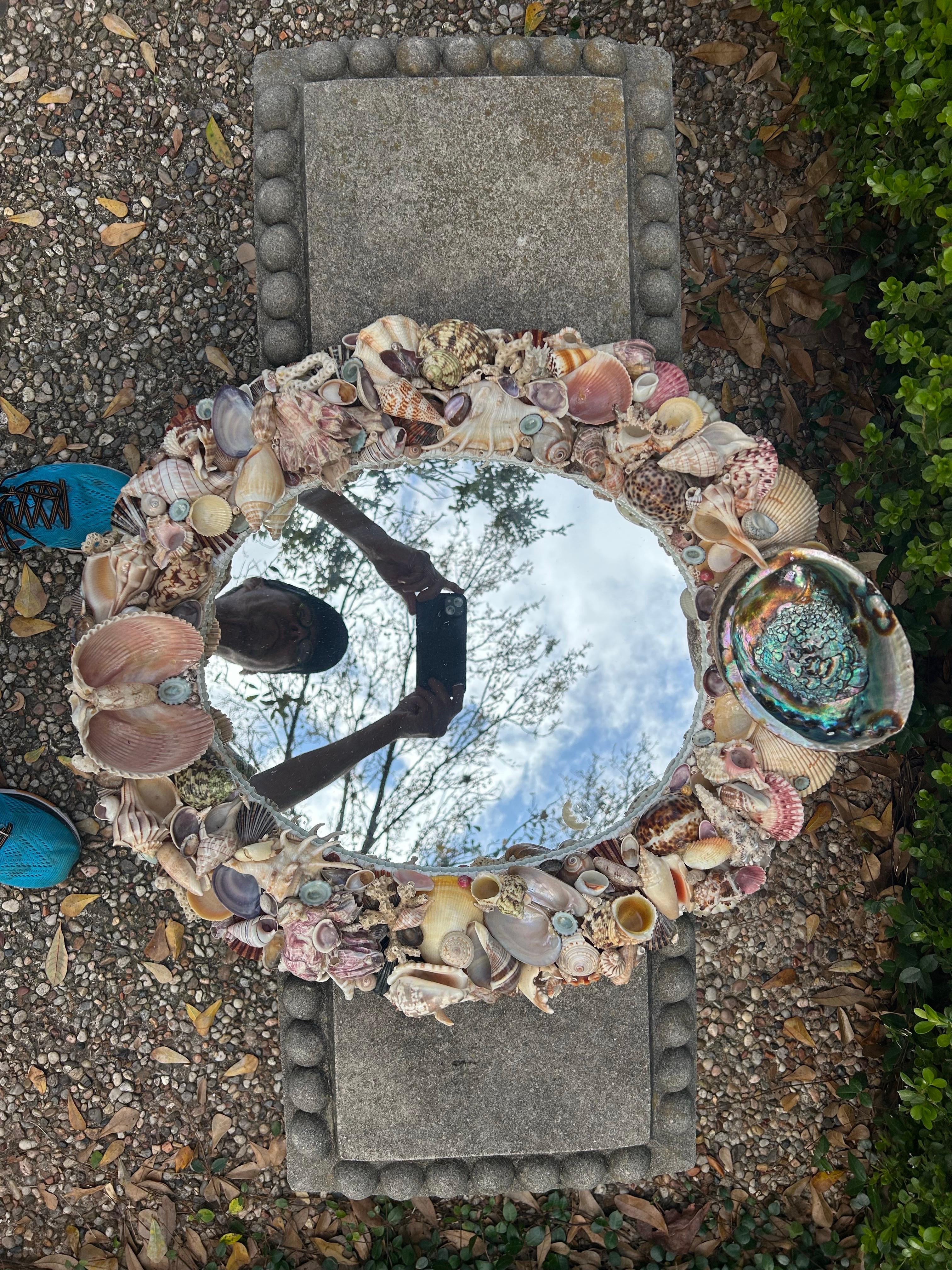 Vintage Oval Seashell Encrusted Mirror.
Offered is a lovely Hollywood Regency style seashell encrusted oval mirror in
earthtone colors.
This beautifully crafted Tony Duquette inspired mirror would be perfect in a powder room, dressing room or