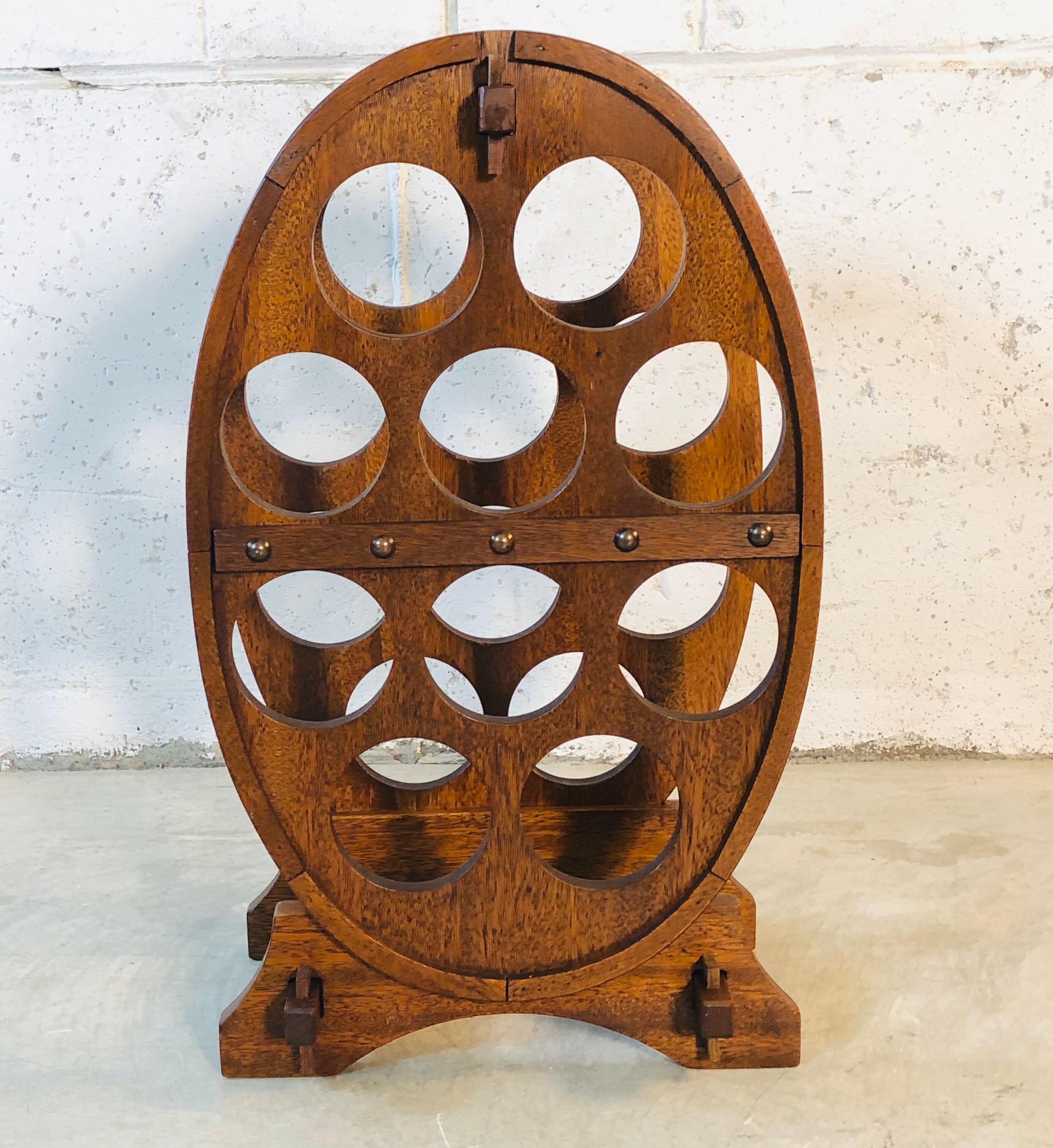 Vintage oval teak wood wine bottle holder that holds ten bottles. Excellent condition. No marks.