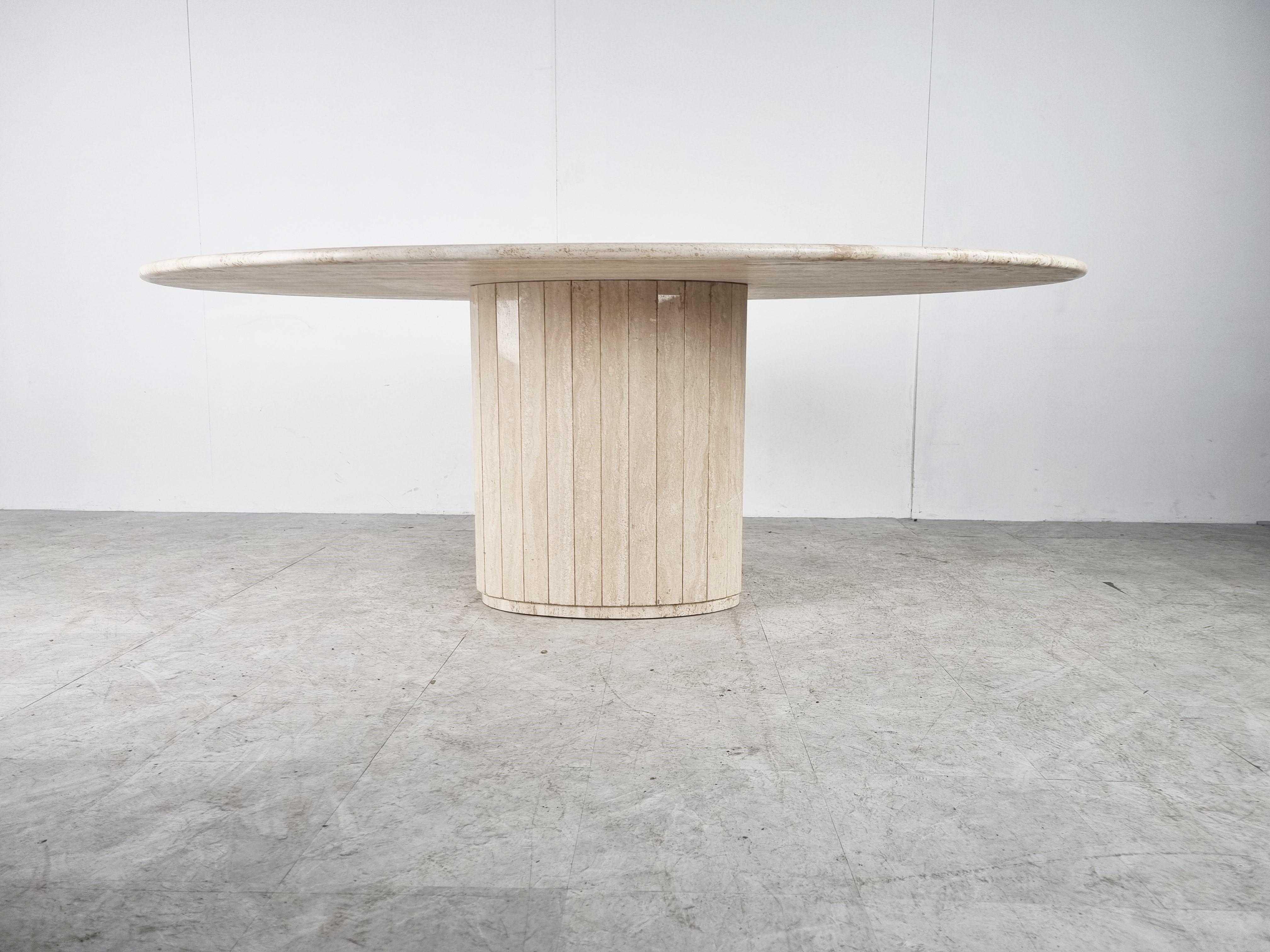 Elegant travertine dining table with a reeded central base. 

Beautiful coloured travertine with a stunning pattern.

Timeless and very beautiful table wich fits most interiors.

Good condition. 

1970s - Italy

Dimensions:
Height:
