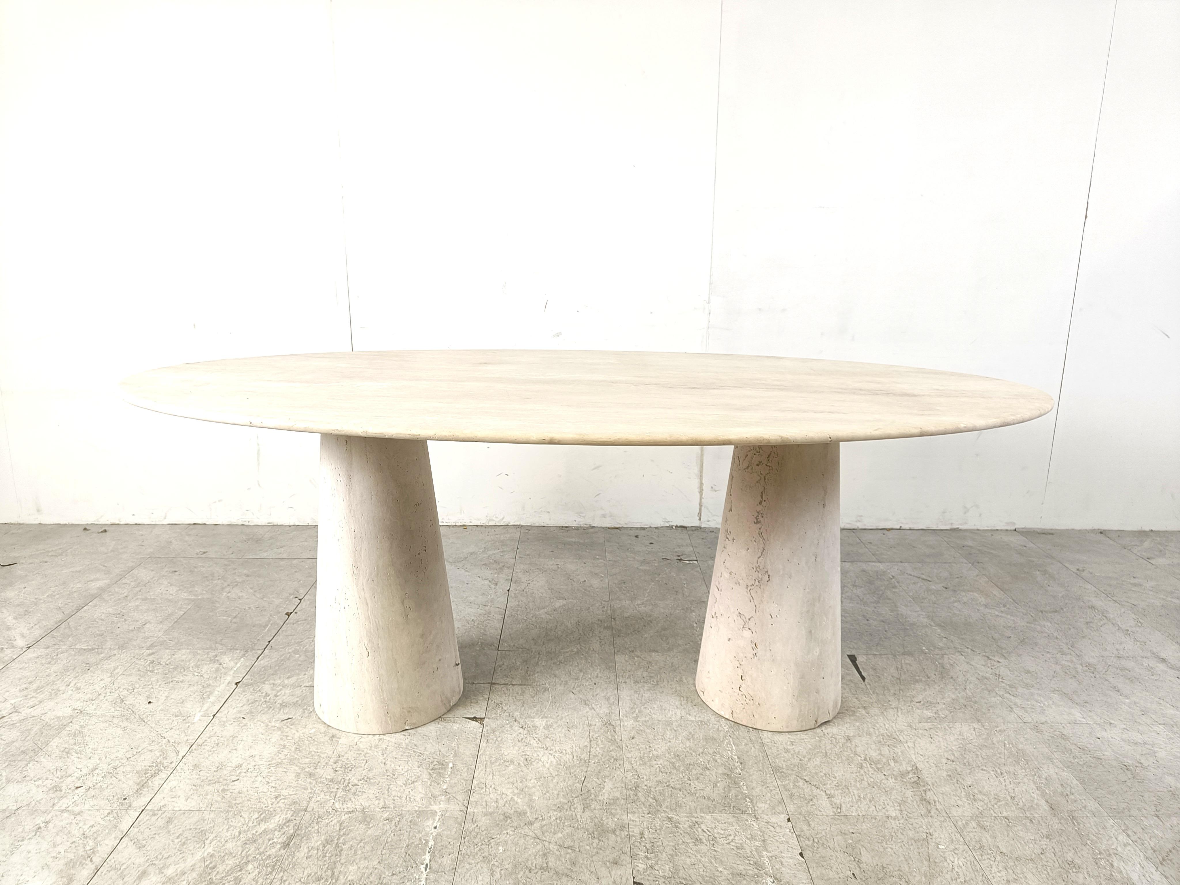 Elegant travertine dining table with two conical pedestal bases. 

Beautiful coloured travertine with lovely pattern.

Timeless and very beautiful table wich fits most interiors.

Good condition. 

Dimensions:
Height: 75cm
Width: 200cm
Depth: