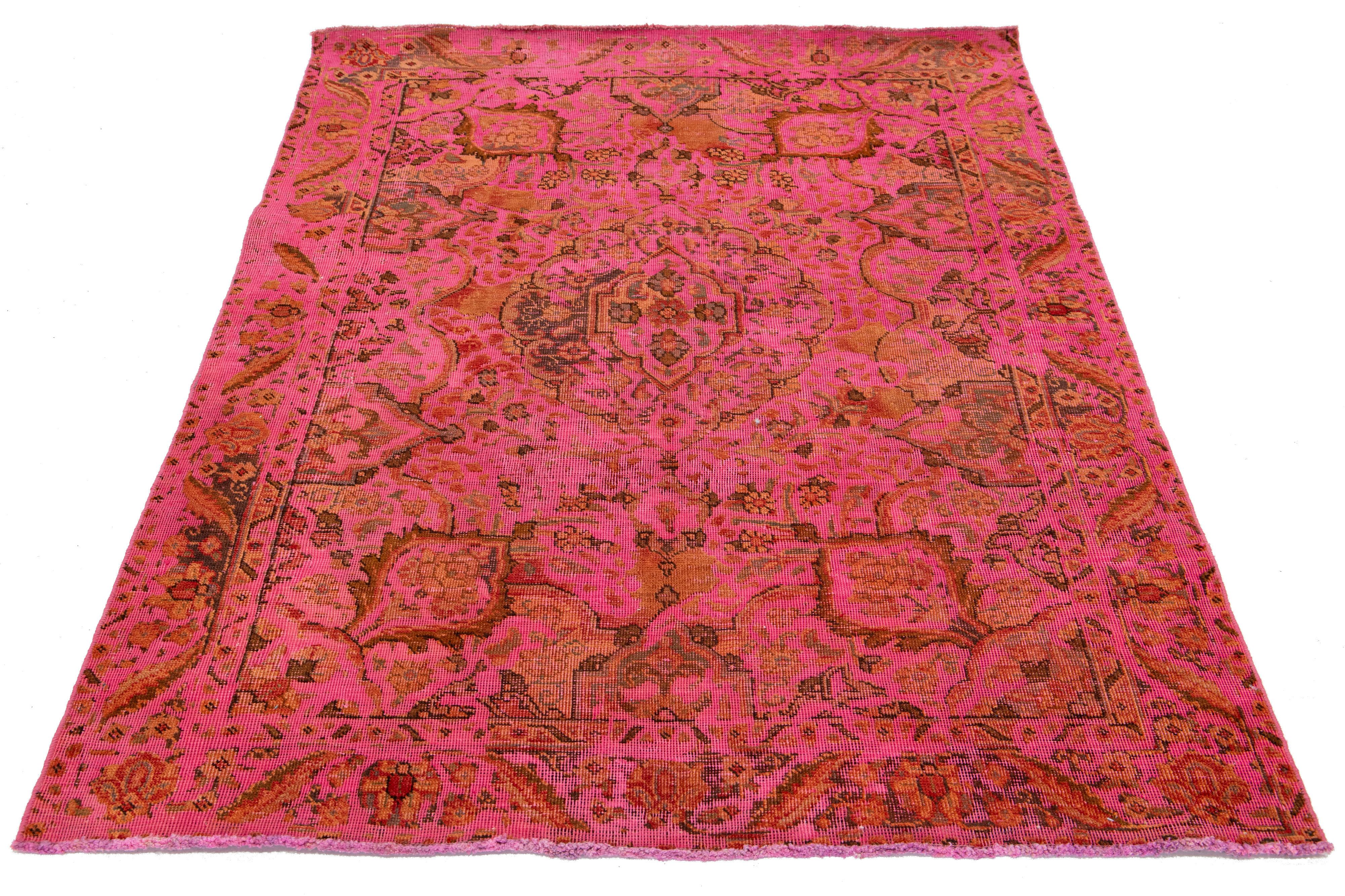 This vintage Persian scatter wool rug has a pink field with multicolor floral accents.

This rug measures 4'3