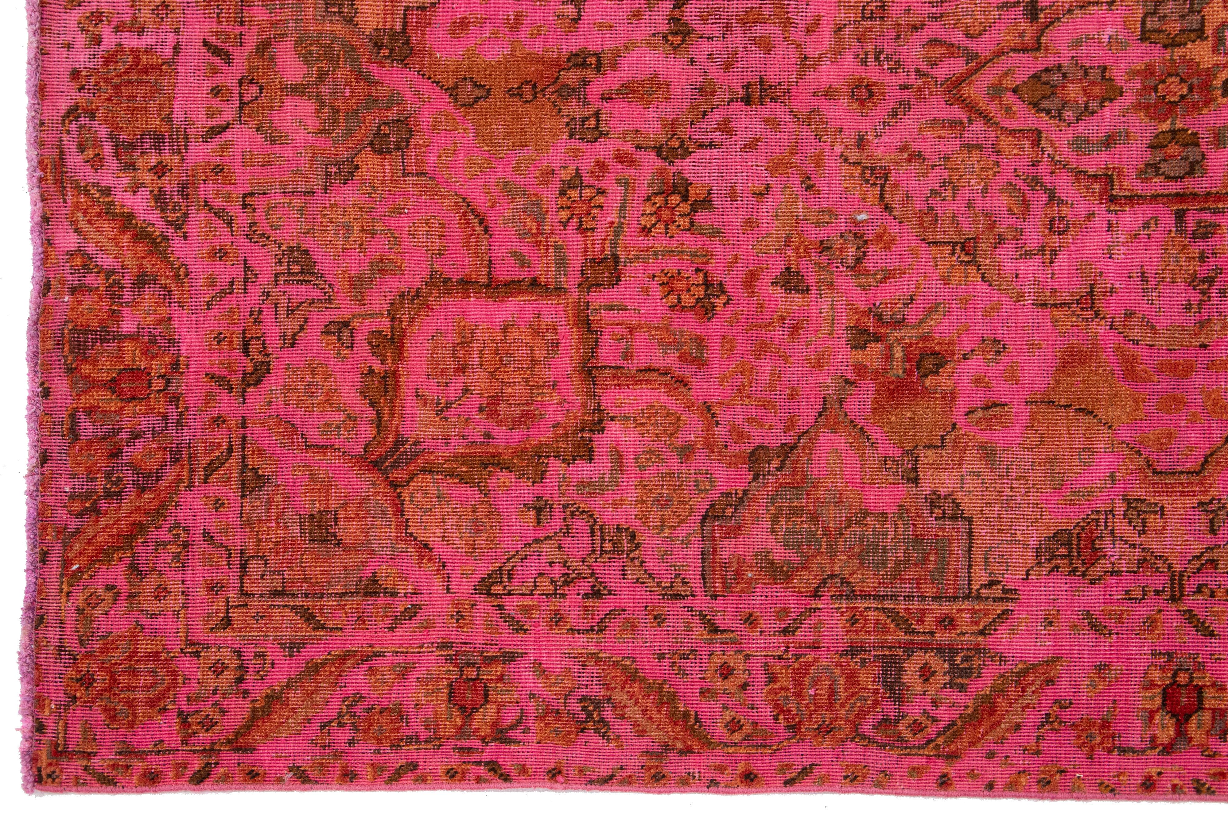 20th Century Vintage Overdyed Persian Wool Rug In Pink With Floral Motif For Sale
