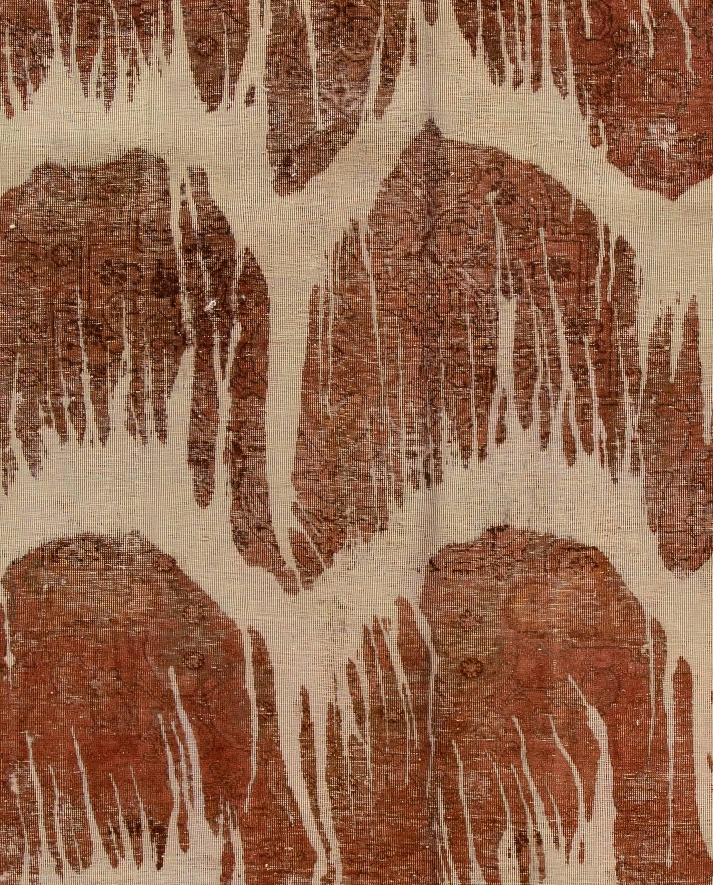 A vintage hand-knotted overdyed distressed rug with an all-over design. This rug measures 8'7