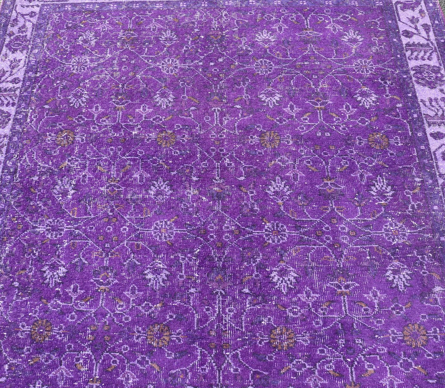 Measures: 5'8 x 9'2.

The field displays a Oushak design, utilizing repeating stylized floral motifs. The border homes a foliage-like pattern complimentary to the field design. The entire piece has been overdyed in shades of purple.

Country of