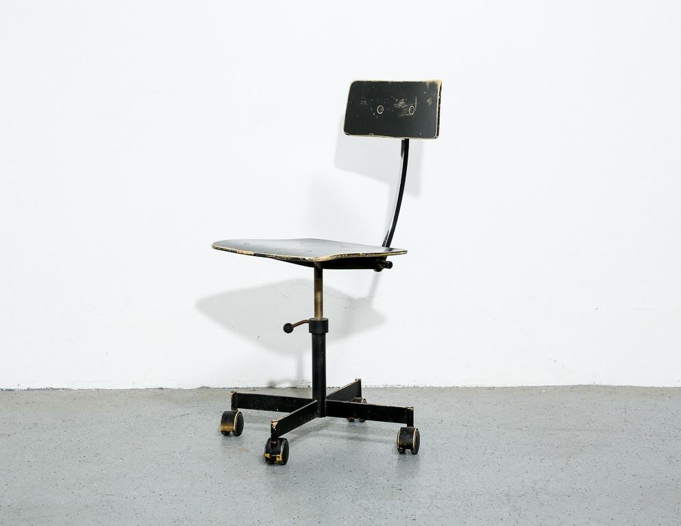Vintage adjustable task chair by Jørgen Rasmussen for Kevi, Denmark. Molded plywood seat and backrest in overpainted black with the original yellow showing through. 18