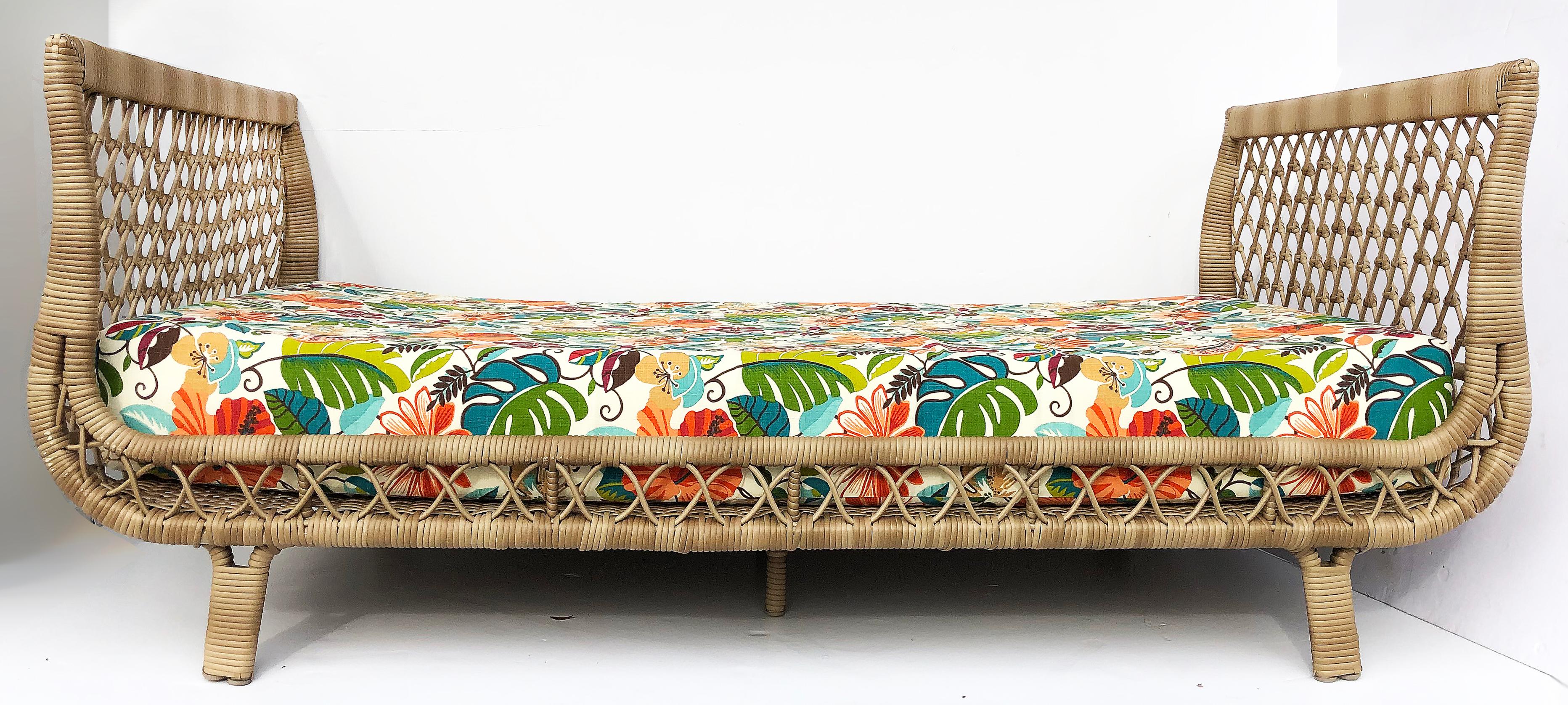 Vintage overscale rattan daybed lounge, reupholstered

Offered for sale is a classically formed coastal rattan daybed lounge. The overscaled mattress has recently been reupholstered in a playful tropical fabric.


Measures: 79