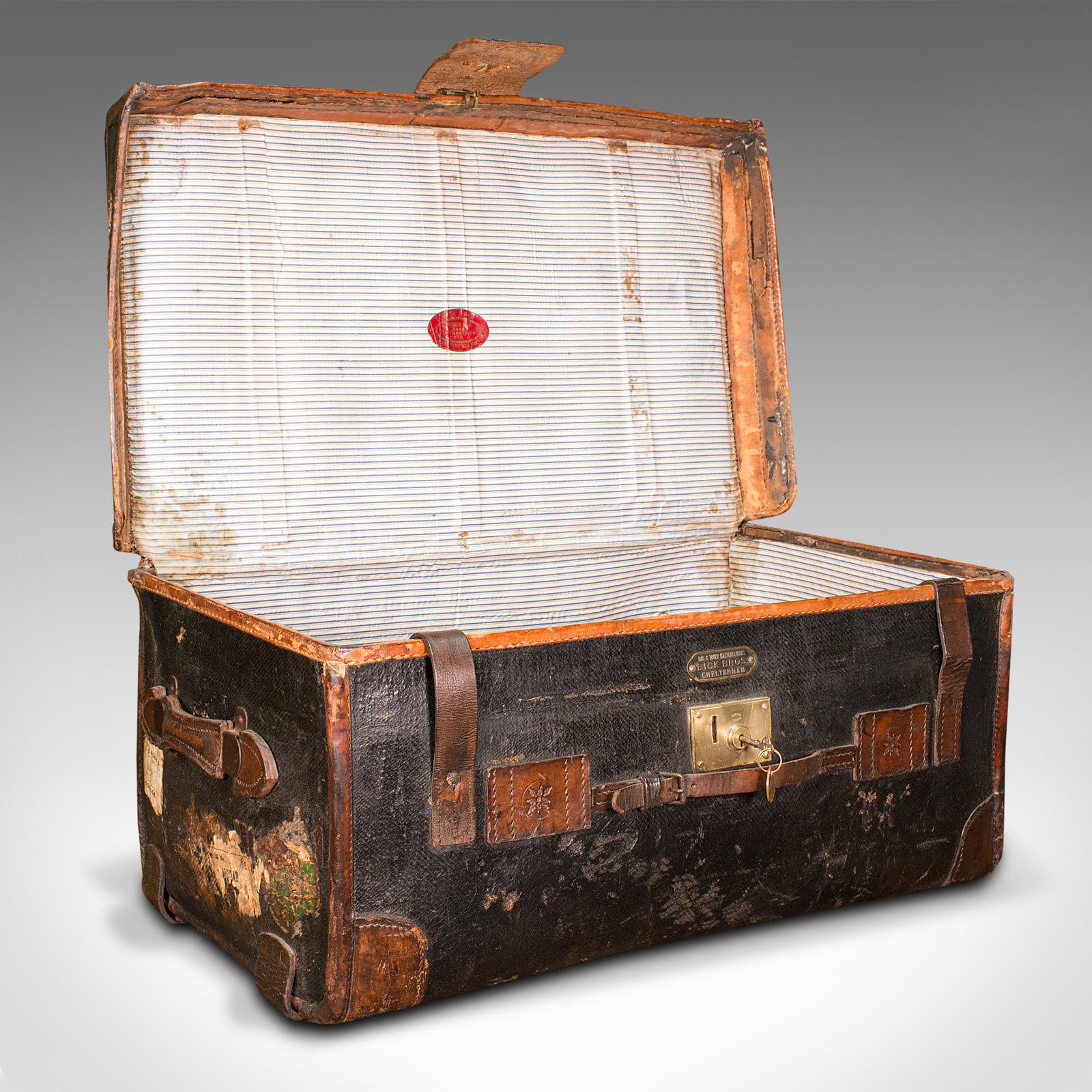 This is a vintage overseas voyage trunk. An English, leather bound travel case, dating to the early 20th century, circa 1930.

Wonderful time-worn appearance from years of travel
Displaying a desirably aged patina throughout
Dark leather