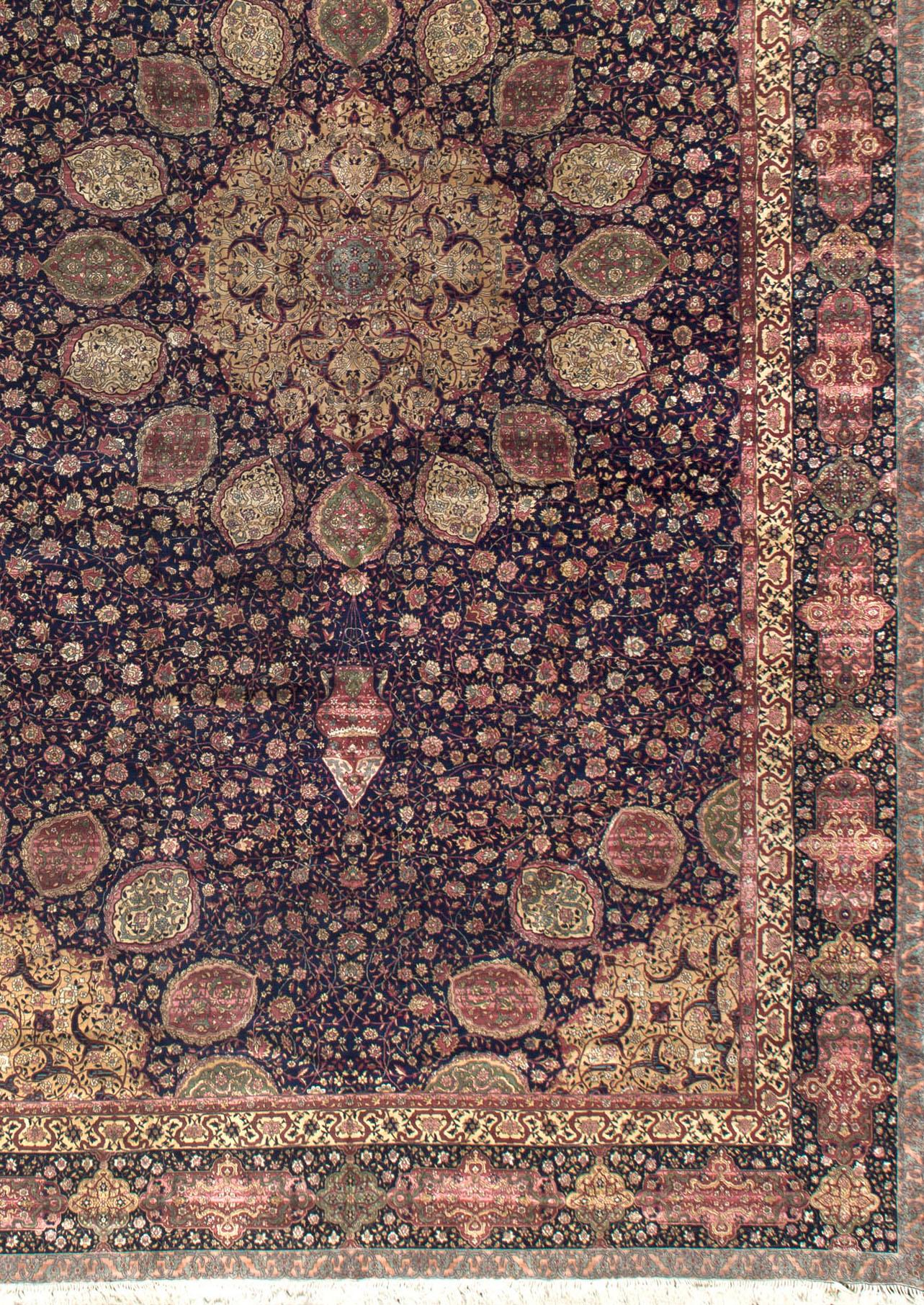 This rug is a replica based off of the world-famous London Ardabil Carpet. The original carpet dates back to 1539, while this replica dates hundreds of years old as well. The rug, which has been displayed at the Victoria and Albert Museum in London,
