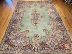 Vintage Oversize Persian Kerman Rug in Floral Pattern in Pale Green, Red, Blue