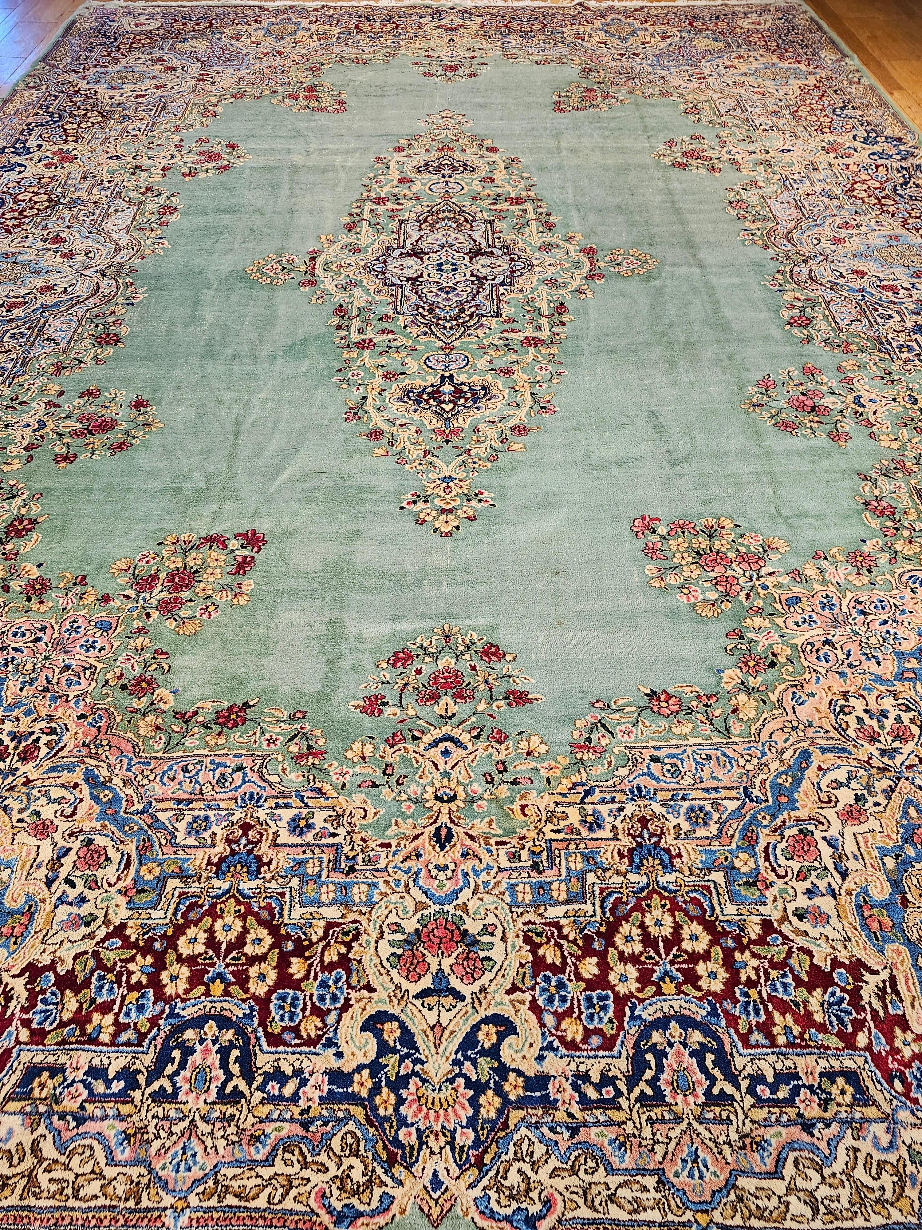 Hand-Woven Vintage Oversize Persian Kerman in Floral Pattern in Pale Green, Red, Blue, Pink For Sale