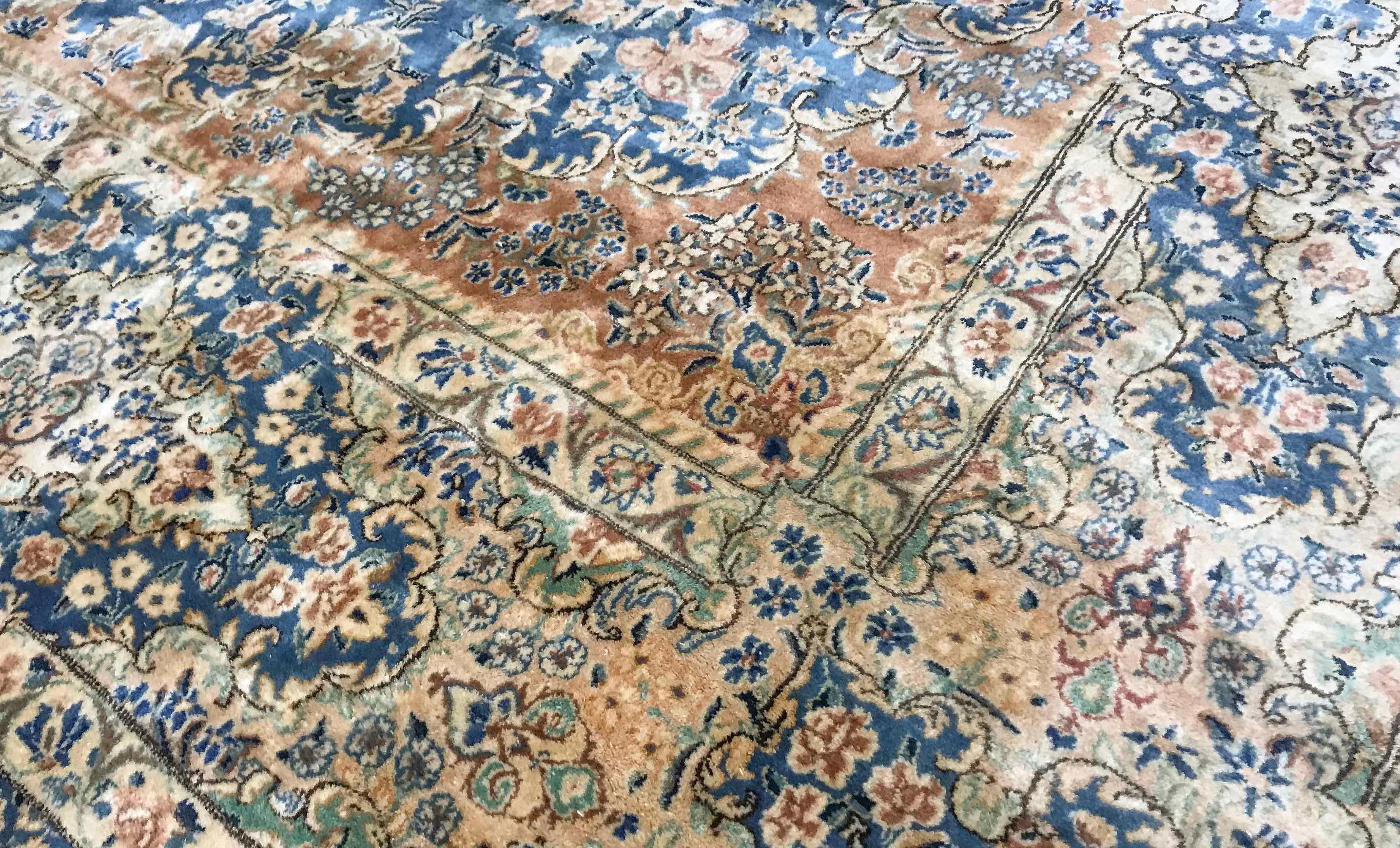 Vintage Persian Kerman rug, circa 1940. This rug is a true work of art the amount of detail woven into this piece is quite amazing from the ivory ground filled to profusion with flowers and vines to the borders again bursting with floral elements a