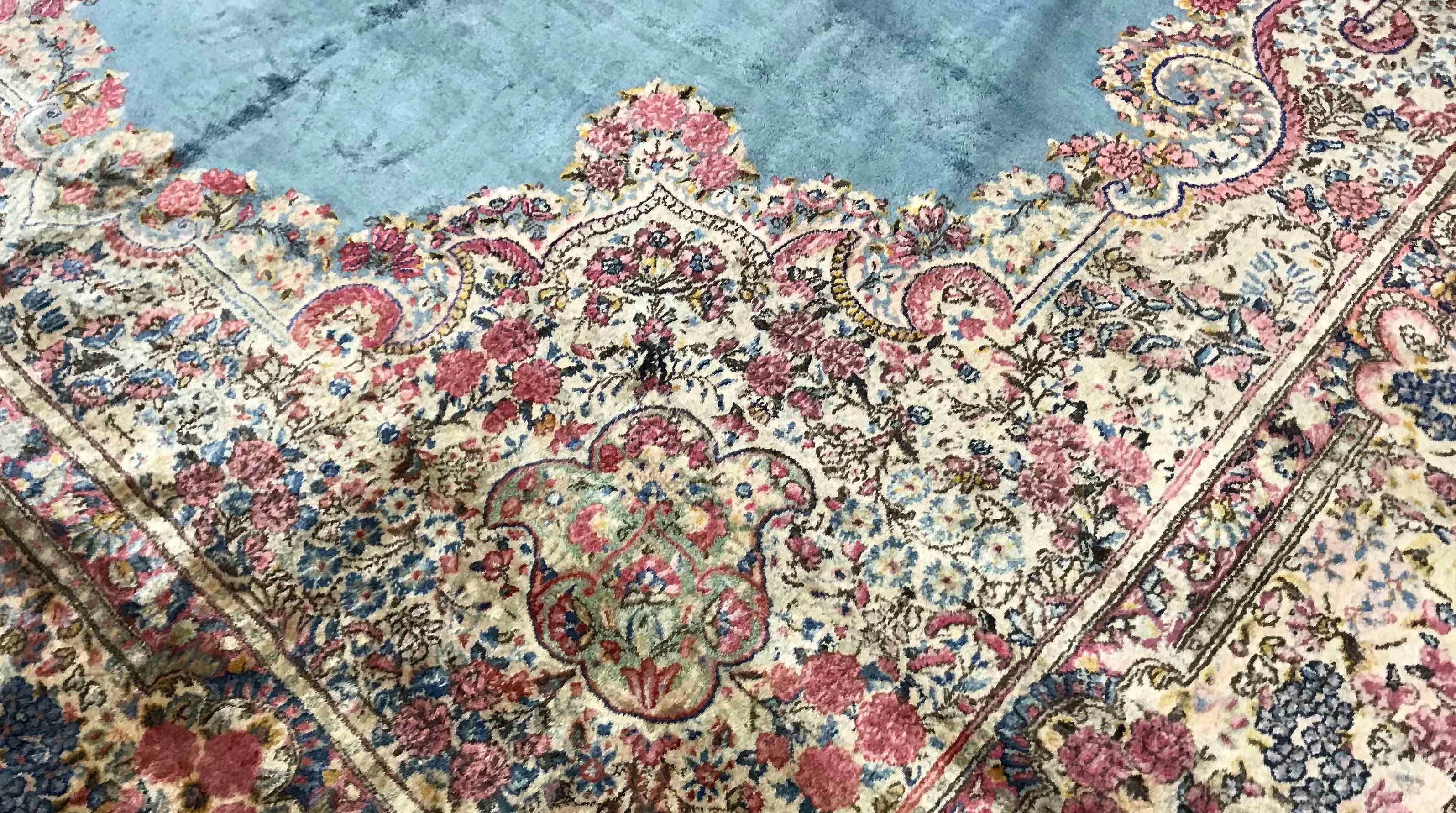 Vintage oversize Persian Kerman rug, circa 1940. This rug is a true work of art the amount of detail woven into this piece is quite amazing from the ivory ground filled to profusion with flowers and vines to the borders again bursting with floral
