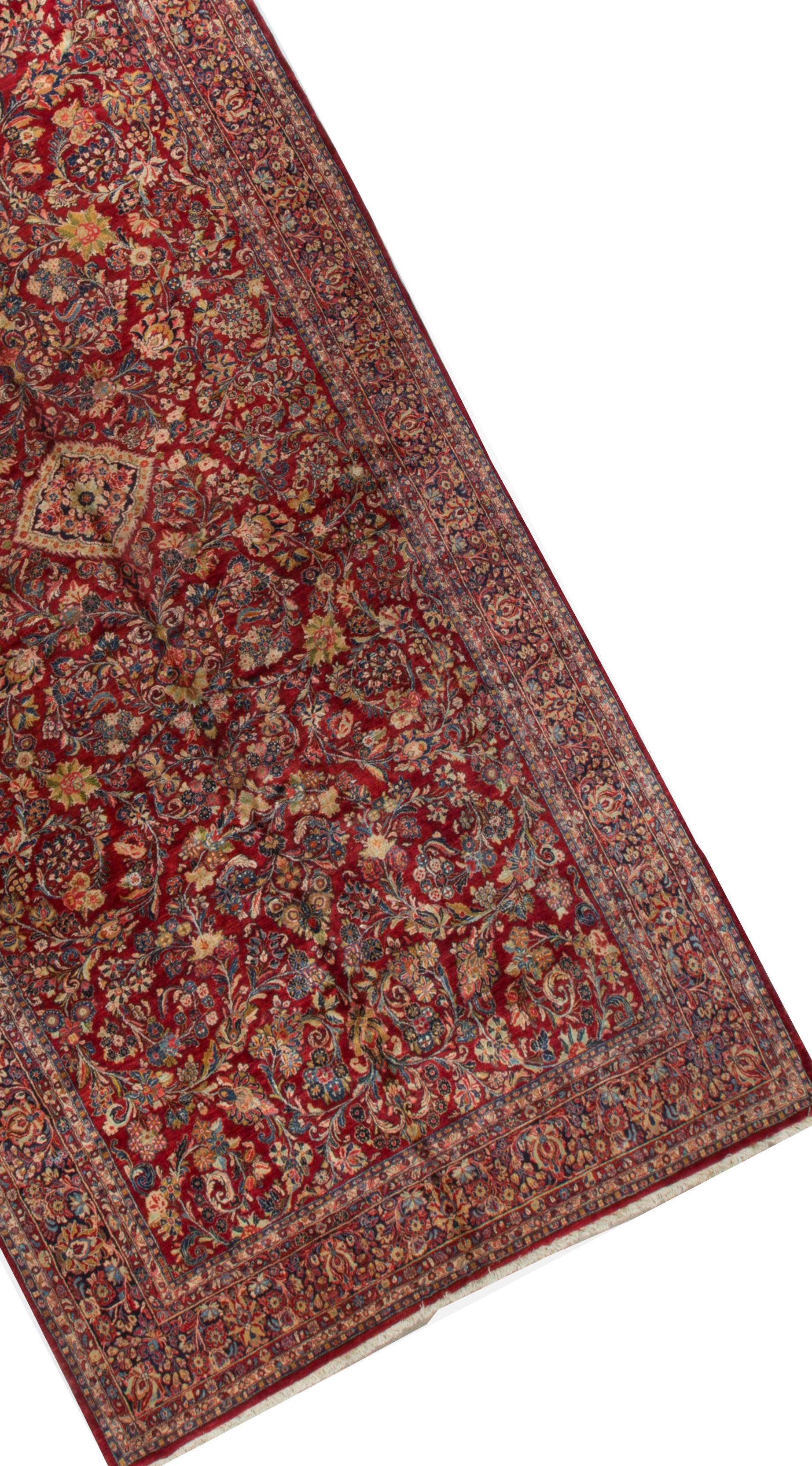 This difficult to find size gallery rug, is designed to create an impact. The whole rug is filled to profusion with detailed floral designs all woven with precision and attention to the smallest detail. Sarouk rugs are from the village of Sarouk