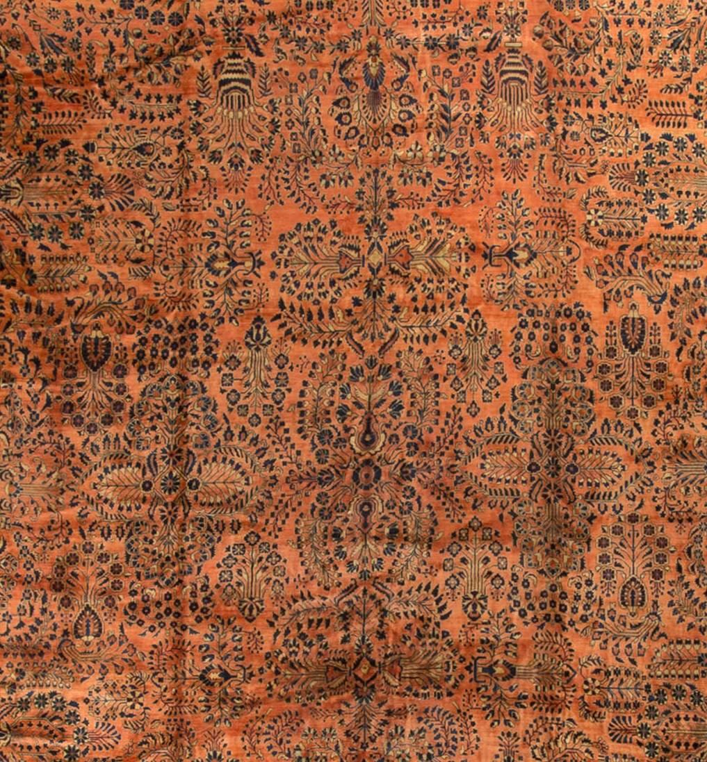Vintage oversize Persian Sarouk rug gallery size, circa 1930. Measures: 15'2 x 29'6. The distinctive colors of this Sarouk rug reflects the style that became so popular in the USA at the beginning of the 20th century. The soft rust-red ground so