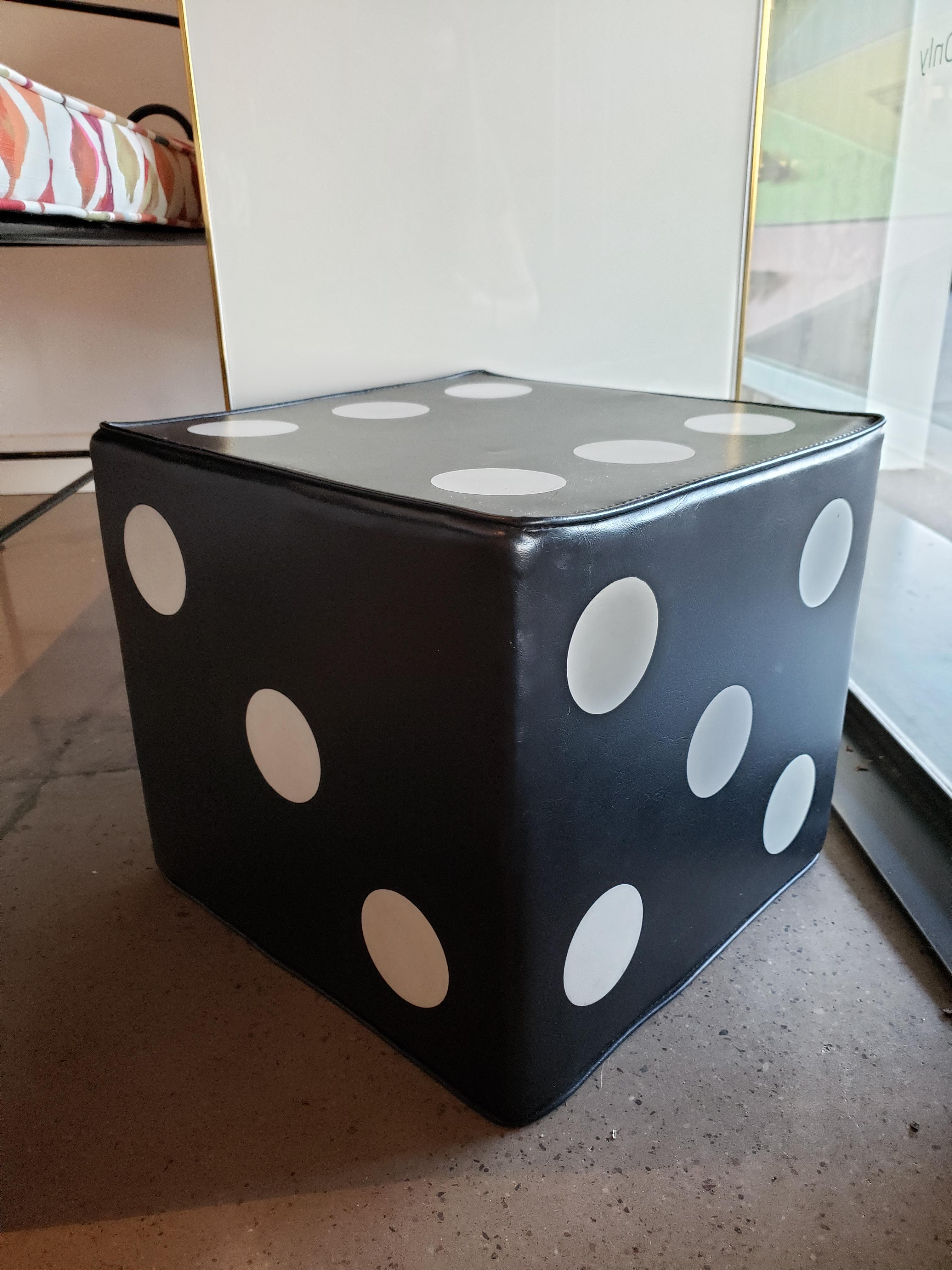 This vintage vinyl dice ottoman is sure to add a touch of whimsy to your interiors. Use as a tabletop sculpture or as an ottoman or side table with a small tray.