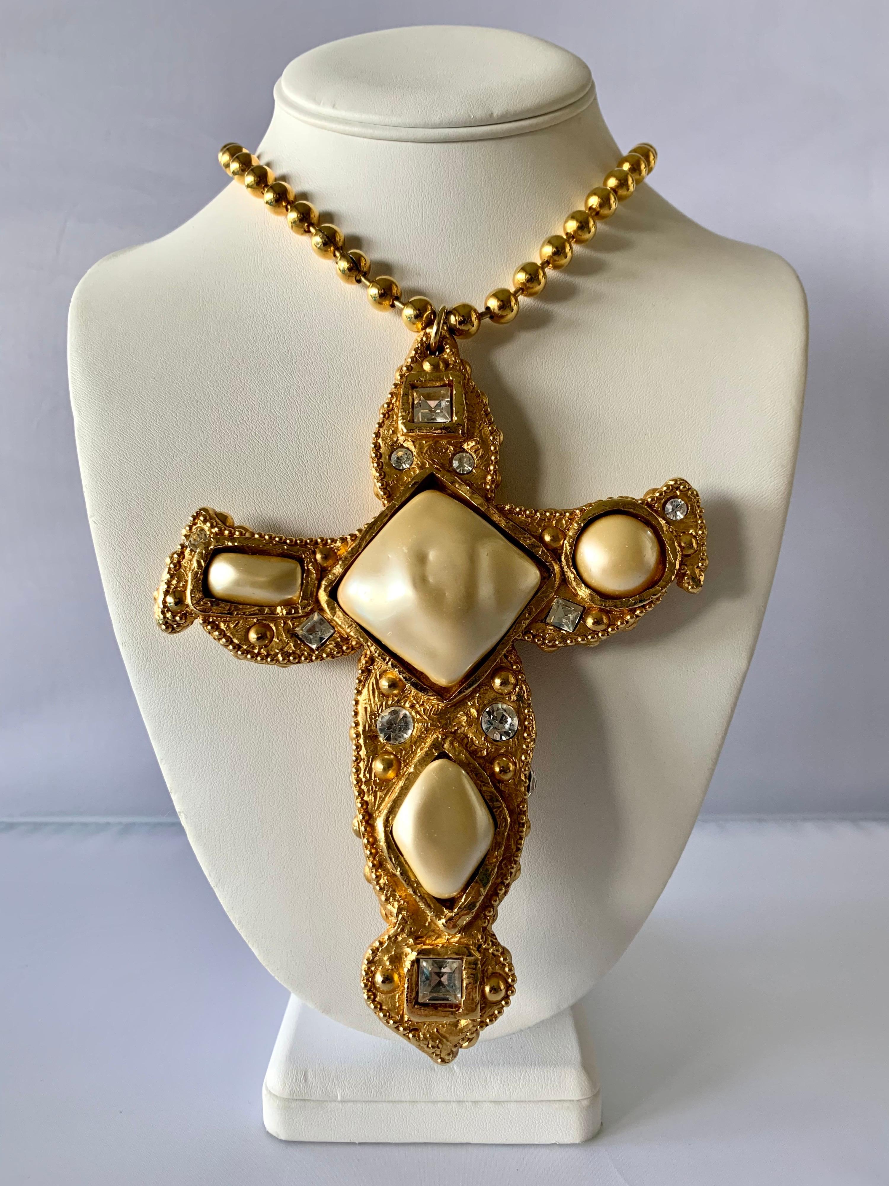 Vintage French oversized pendant necklace featuring an oversized gold resin cross embellished with large faux pearls and diamante rhinestones in a Byzantine manner - signed Alexis Lahellec on the back made in Paris.

The pendant measures 6 inches