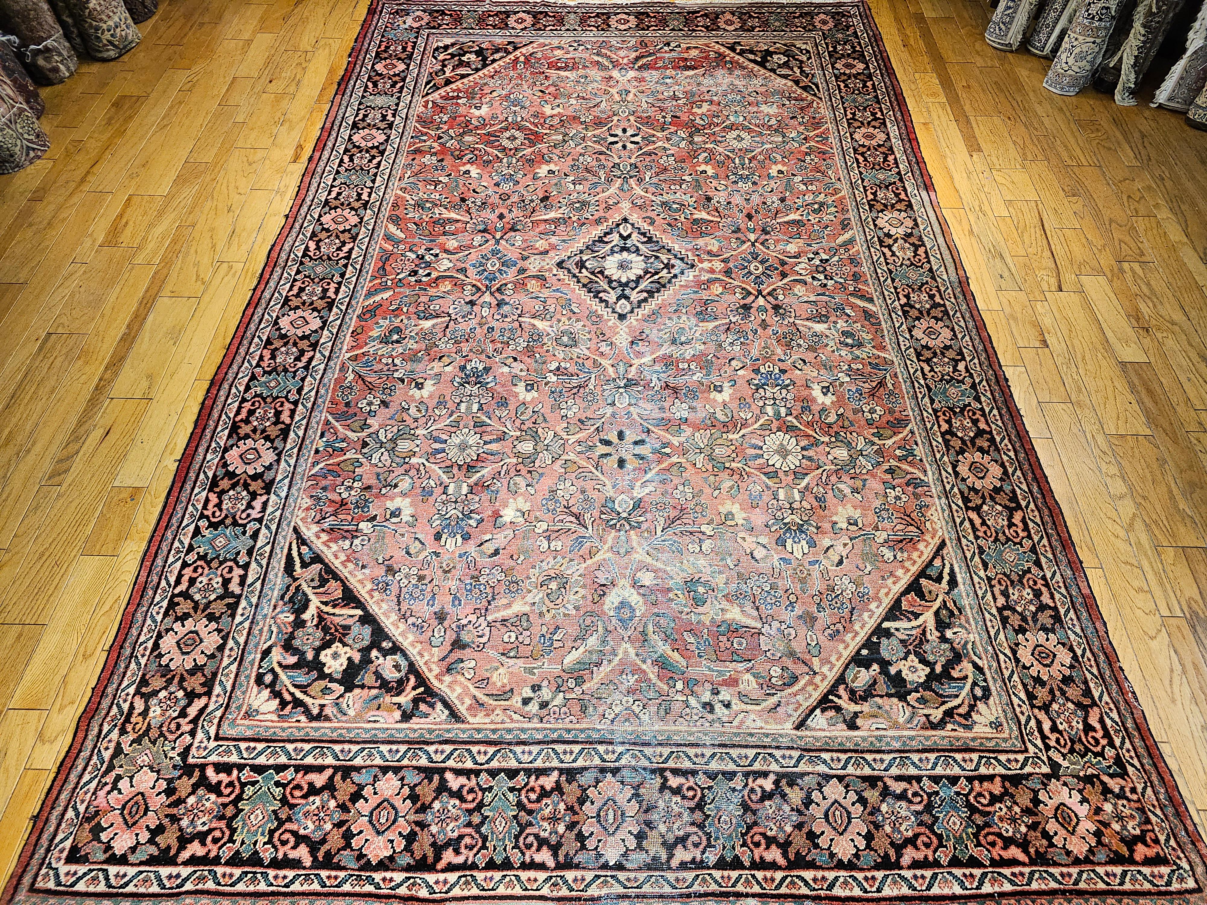 Beautiful oversized antique Mahal Sultanabad handwoven carpet from the early 1900s.  The rug has the feel and look of the bygone times when the weaving art was much appreciated.  It has an 