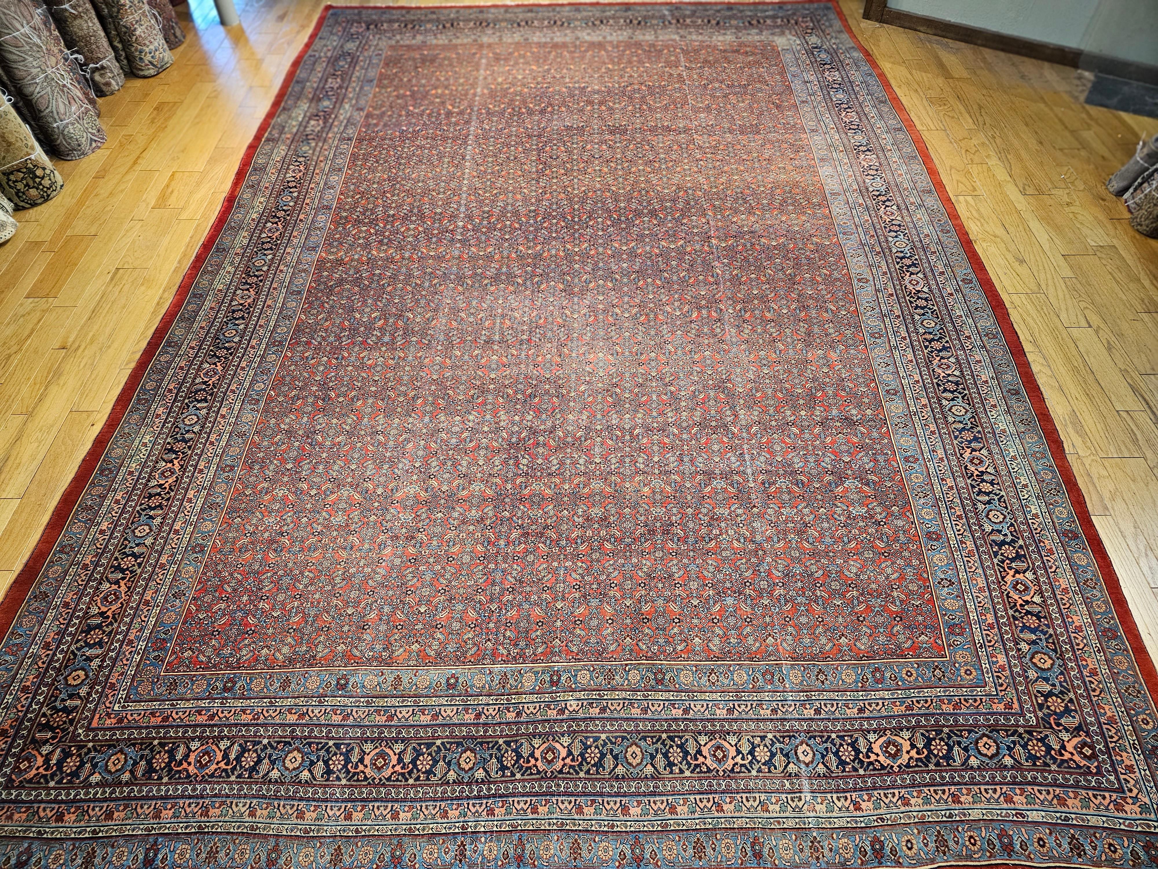 Vintage oversized (mansion or palace size) hand-knotted Persian Bidjar is a masterpiece of the early 20th-century in an all over Herati pattern. This Bidjar rug is an exceptional piece in every aspect of design and production. This rug has an