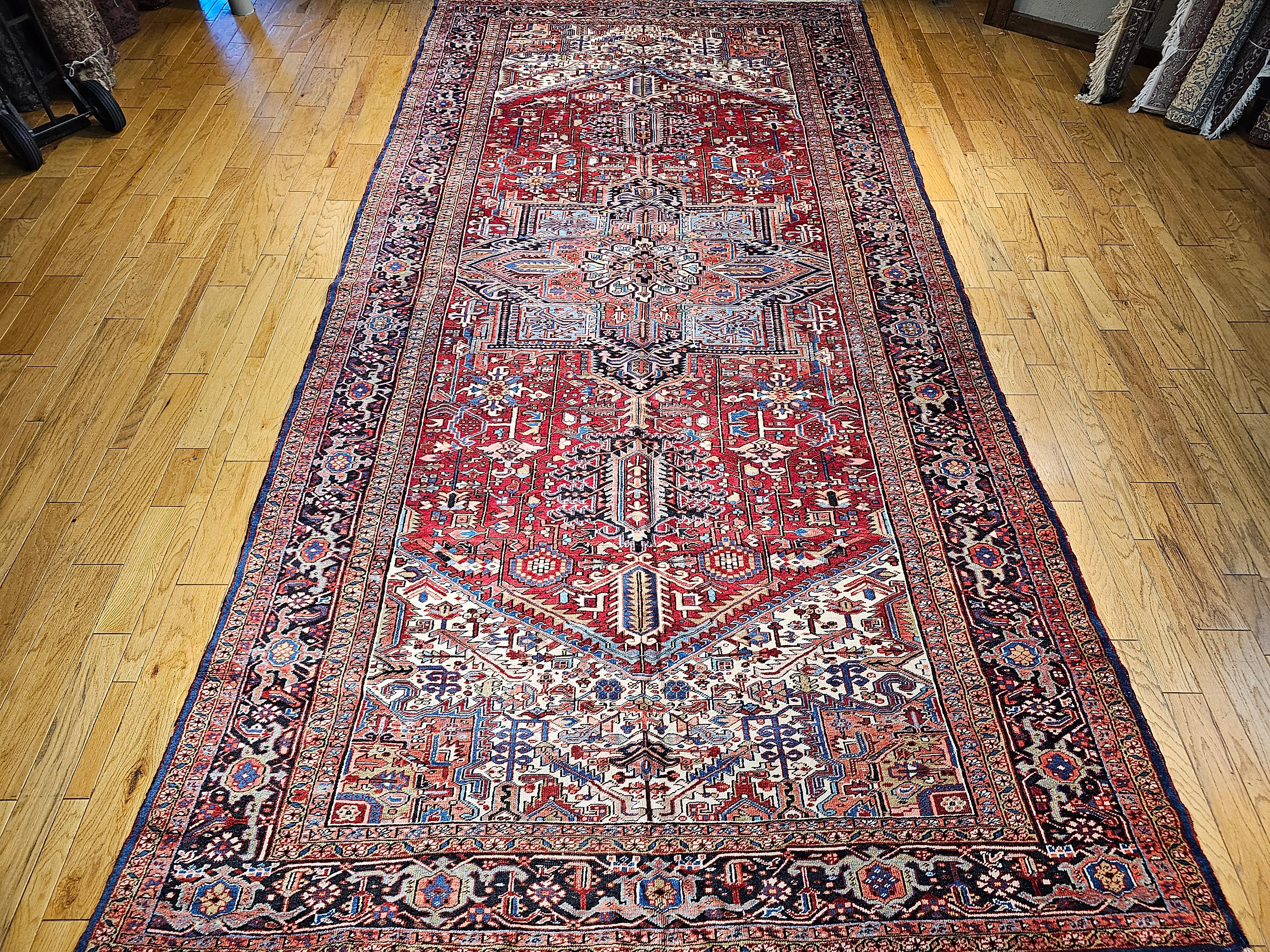 An oversized Heriz Serapi rug from the Azerbaijan region of Northwest Persia. The Heriz rugs have ageless beauty and because of the use of natural dyes, they develop more beautiful color hues (abrash) over many generations of use. This Heriz rug has
