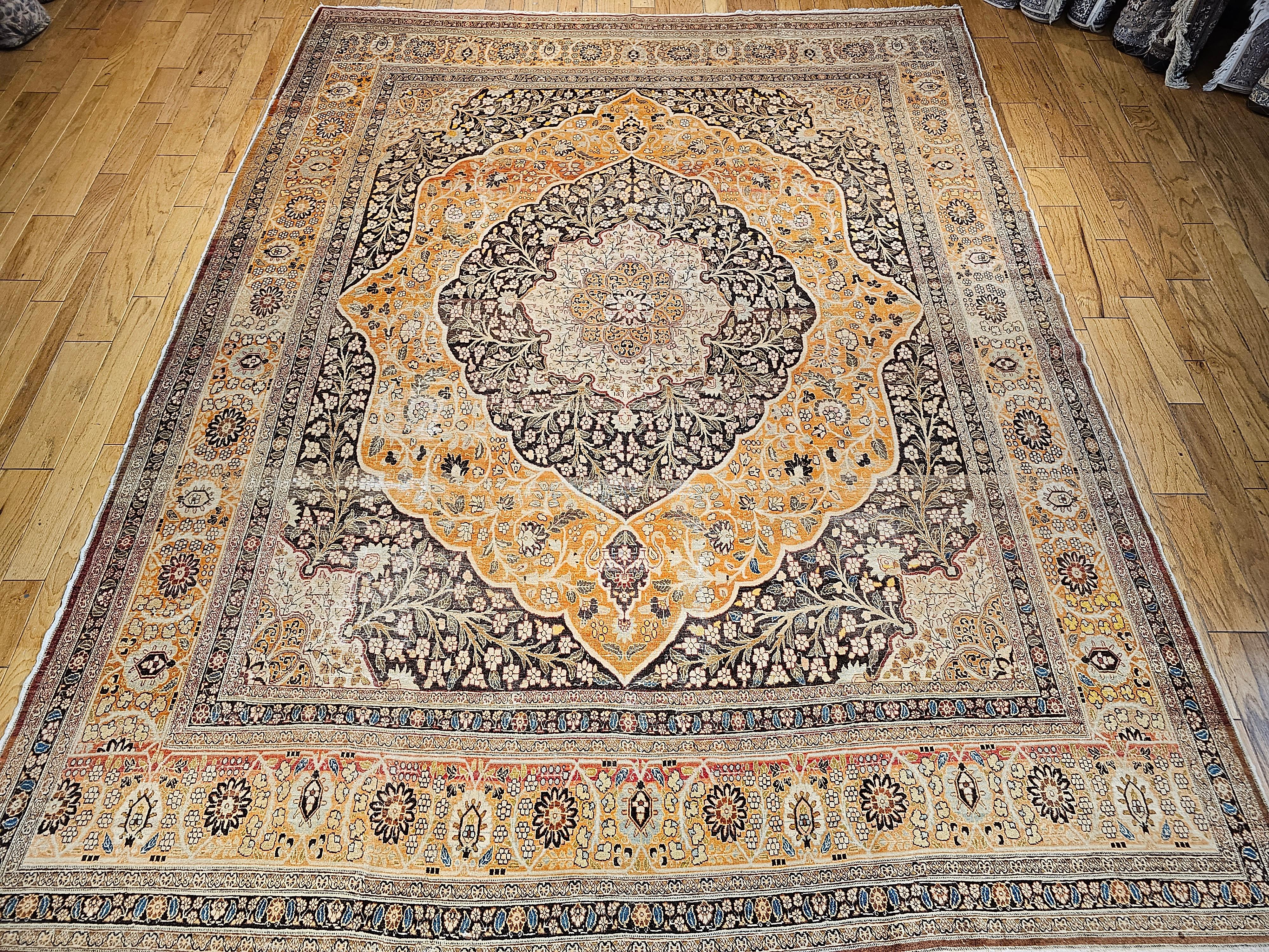 Wonderful vintage floral Tabriz from the early 1900s.  This inspiring Tabriz oversize rug reflects the style of Haji Jalili, the world-renowned 19th-century master weaver from Tabriz, Persia.  This Tabriz rug has a sophisticated vines design set in