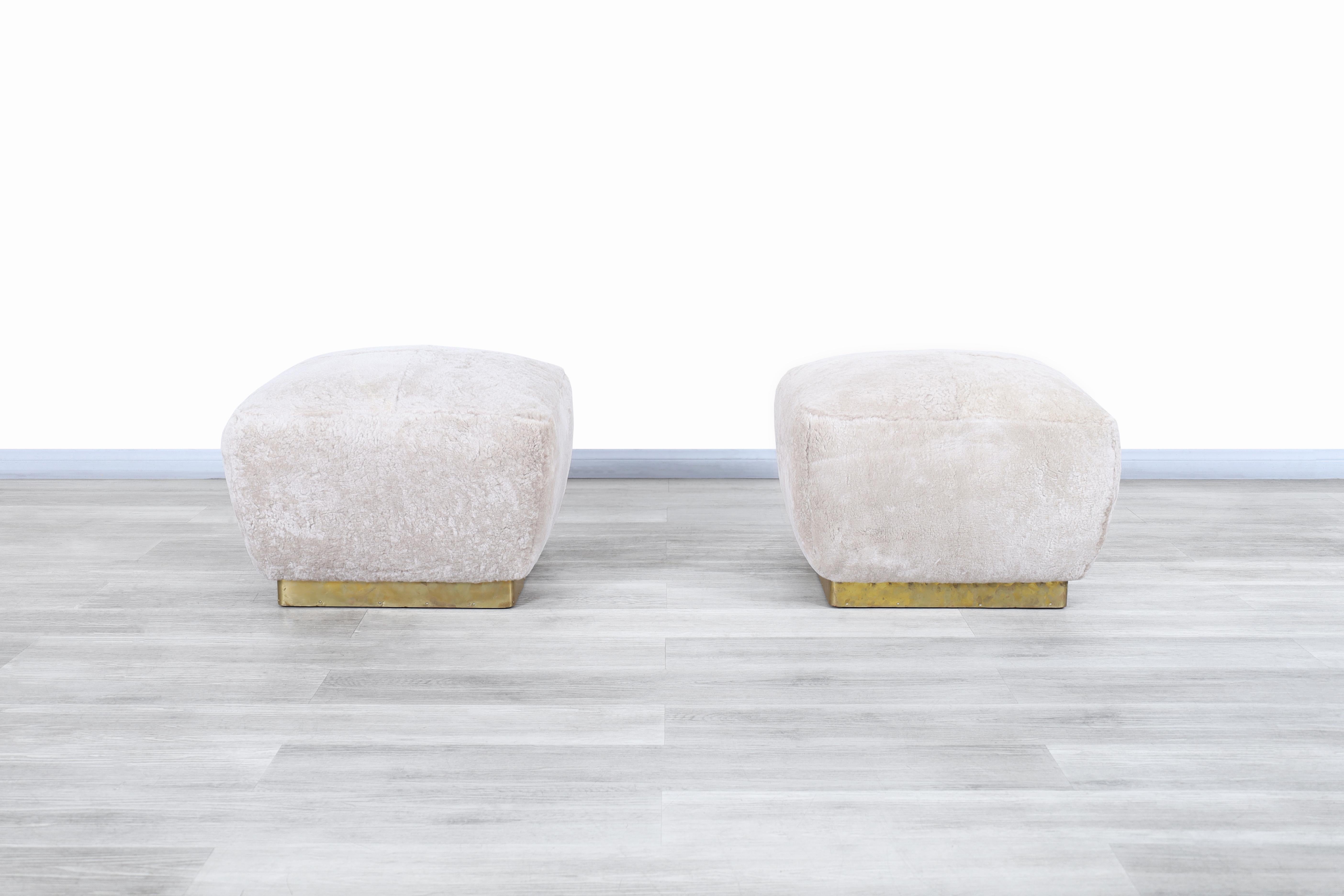 Beautiful vintage oversized brass “Poufs” designed by Marge Carson in the United States, circa 1980s. These poufs have a minimalist design where the cubic shape of their structure and the comfort of their use stand out. Each pouf has a personalized
