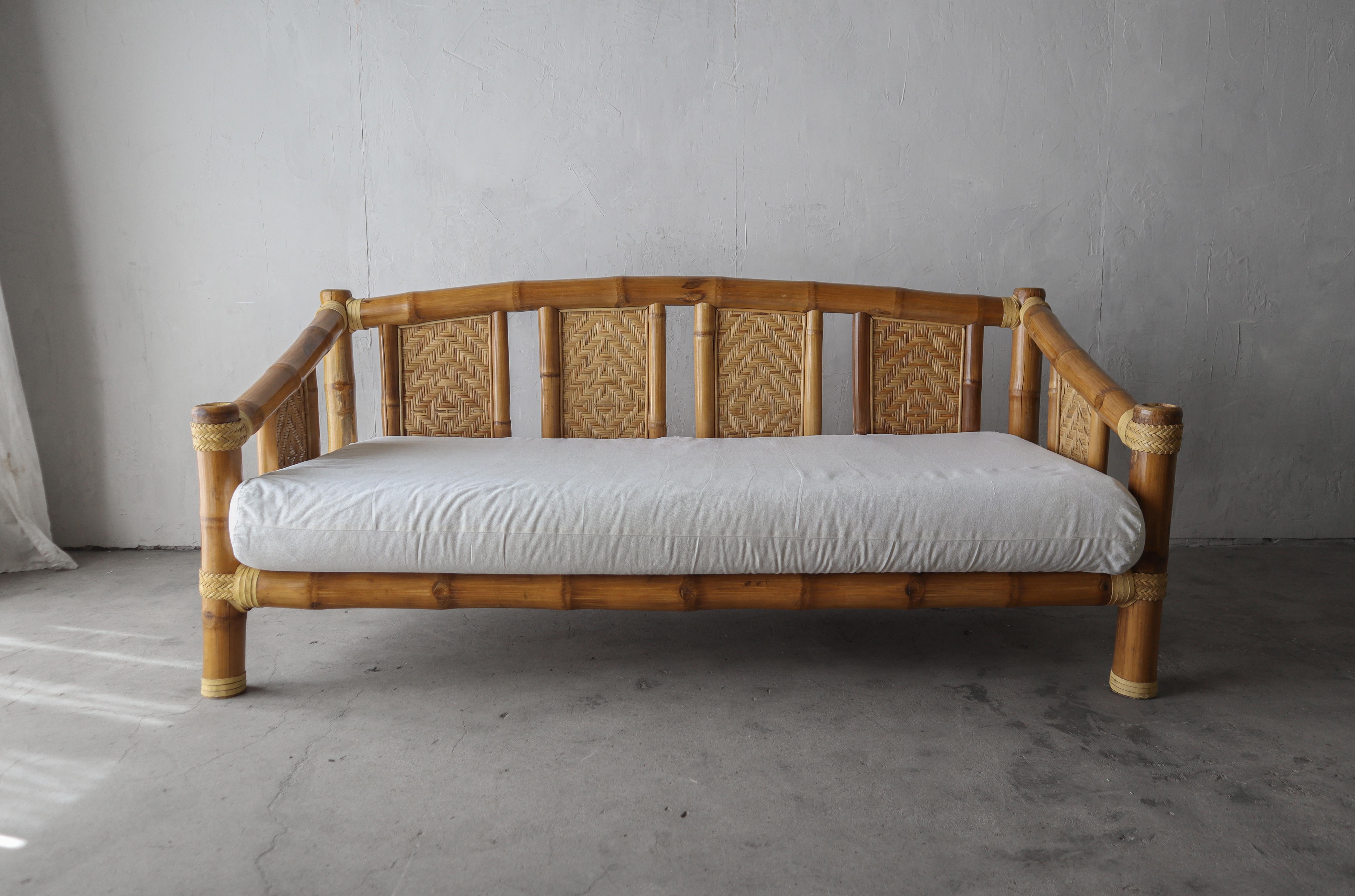 What a unique and special piece. The oversized bamboo really makes this massive vintage daybed sofa a super cool and artistic piece. If you have been looking for real statement piece, look no further.

The bamboo is in excellent and 100%