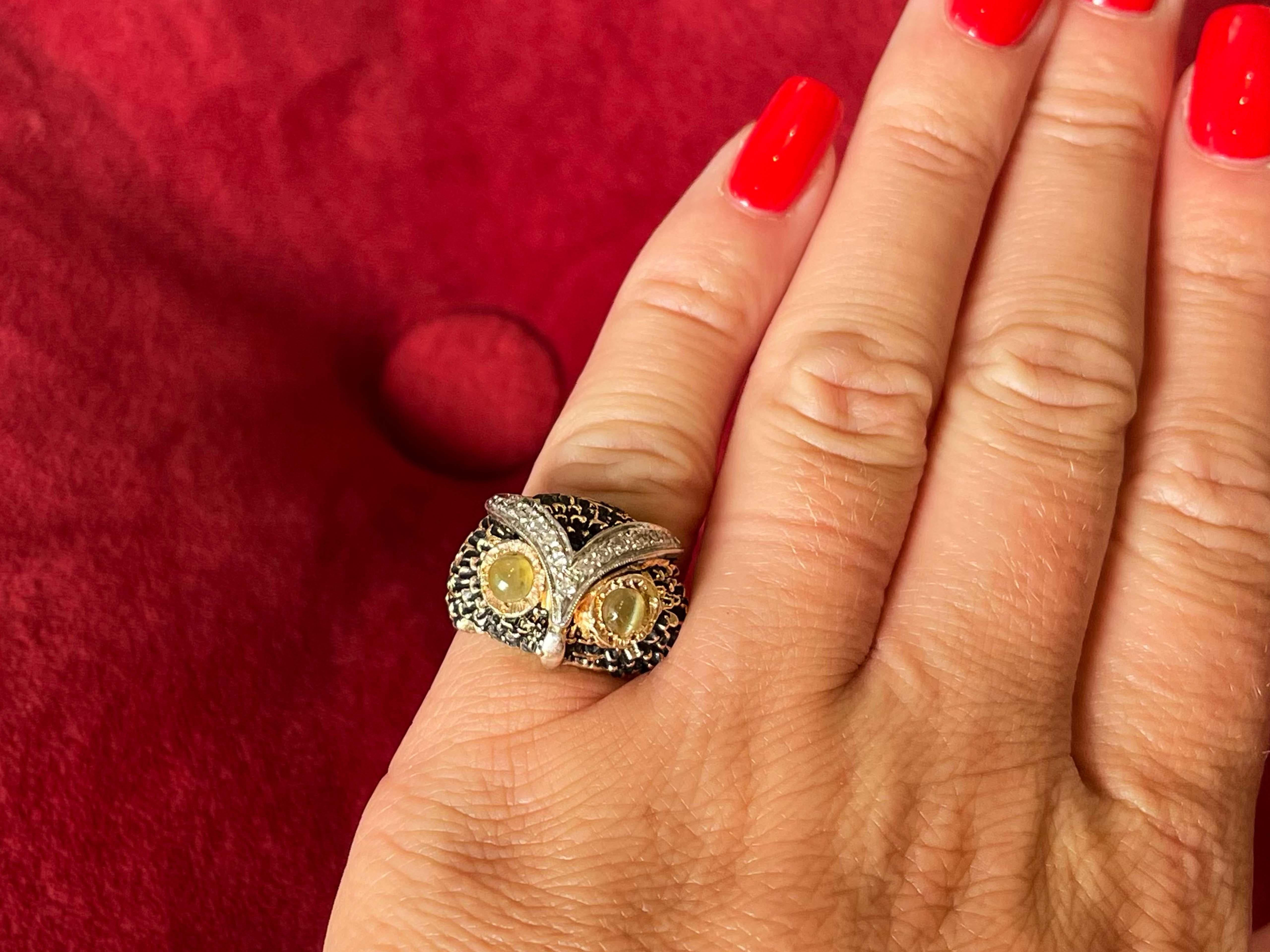 Item Specifications:

Metal: 14K Yellow Gold

Total Weight: 11.7 Grams

Ring Size: 5.5

Diamond Count: 15 single cut diamonds

Diamond Carat Weight: ~0.15 Carats

Diamond Color: G-H

Diamond Clarity: VS2-SI1
​
​Gemstone: 2 Cats Eye