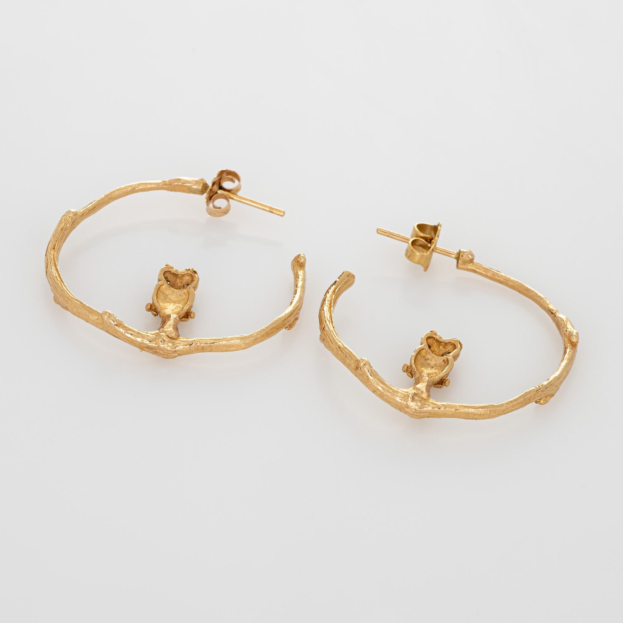 Distinct and stylish pair of diamond owl hoop earrings crafted in 14k yellow gold. 

Four round brilliant cut diamonds total an estimated 0.02 carats (estimated at I-J color and SI1-I1 clarity).  

The charming earrings feature two owls perched on a