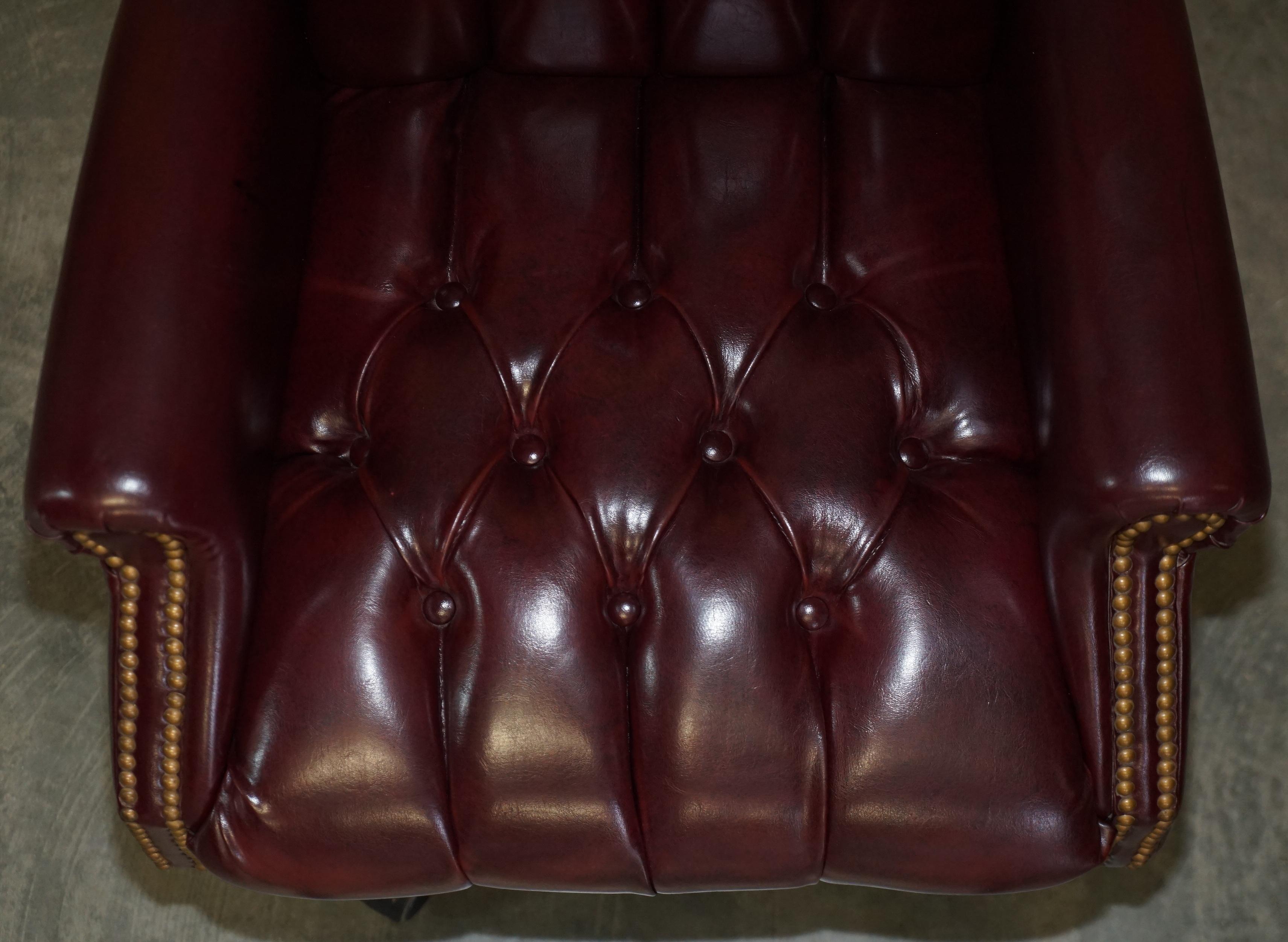 Vintage Oxblood Leather Antique Stud Chesterfield Wingback Swivel Office Chair For Sale 4