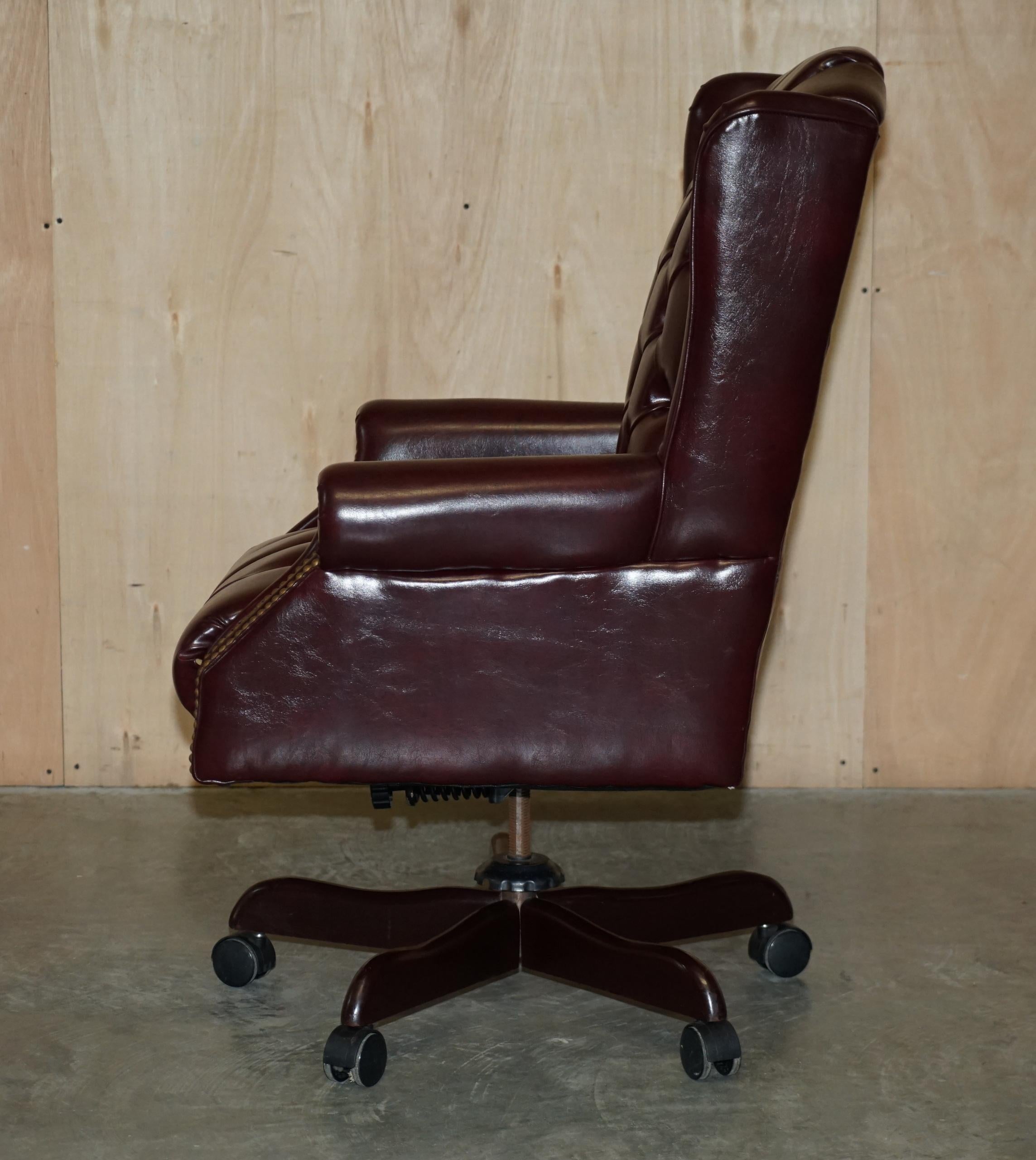 Vintage Oxblood Leather Antique Stud Chesterfield Wingback Swivel Office Chair For Sale 9