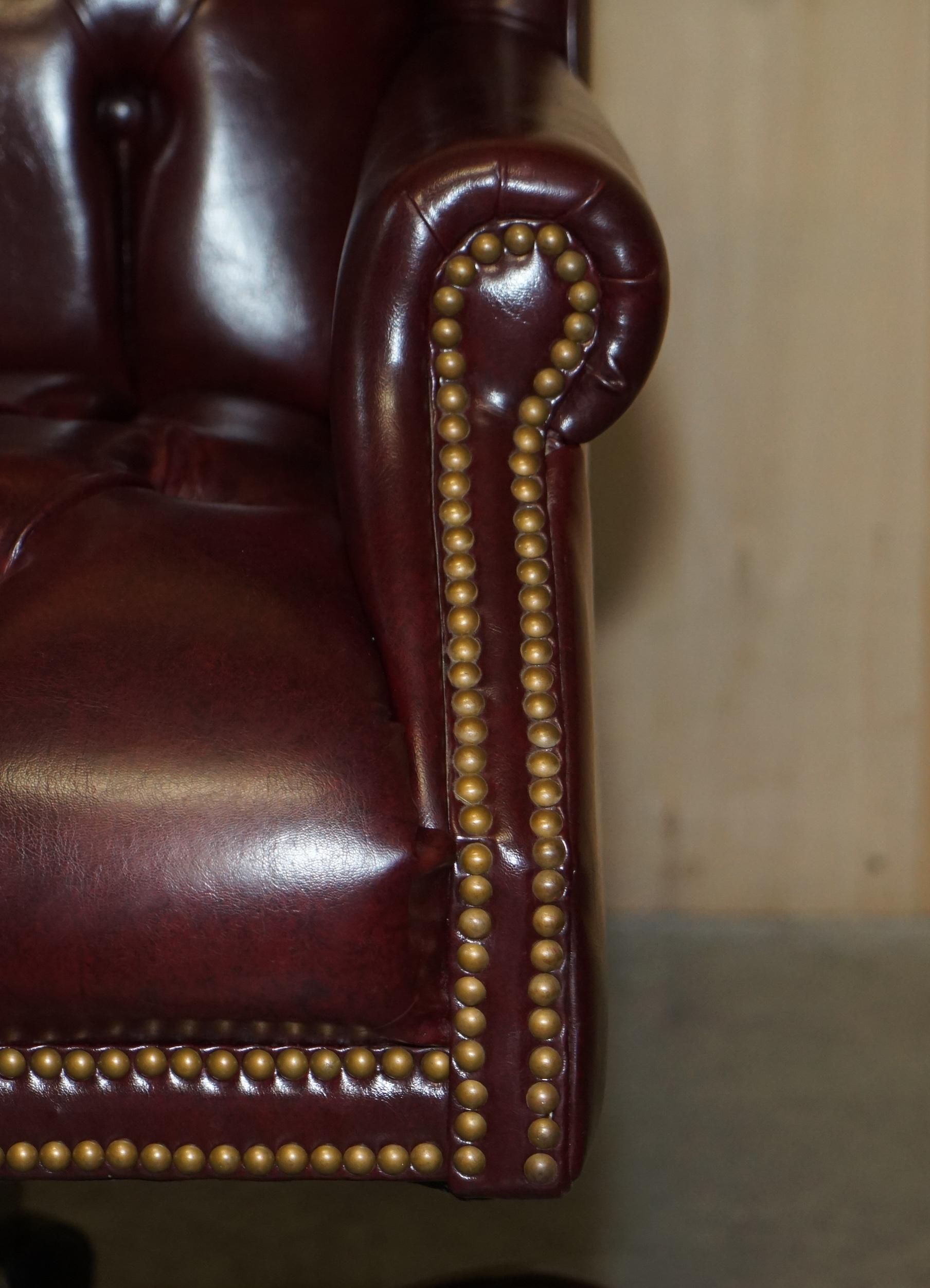 20th Century Vintage Oxblood Leather Antique Stud Chesterfield Wingback Swivel Office Chair For Sale