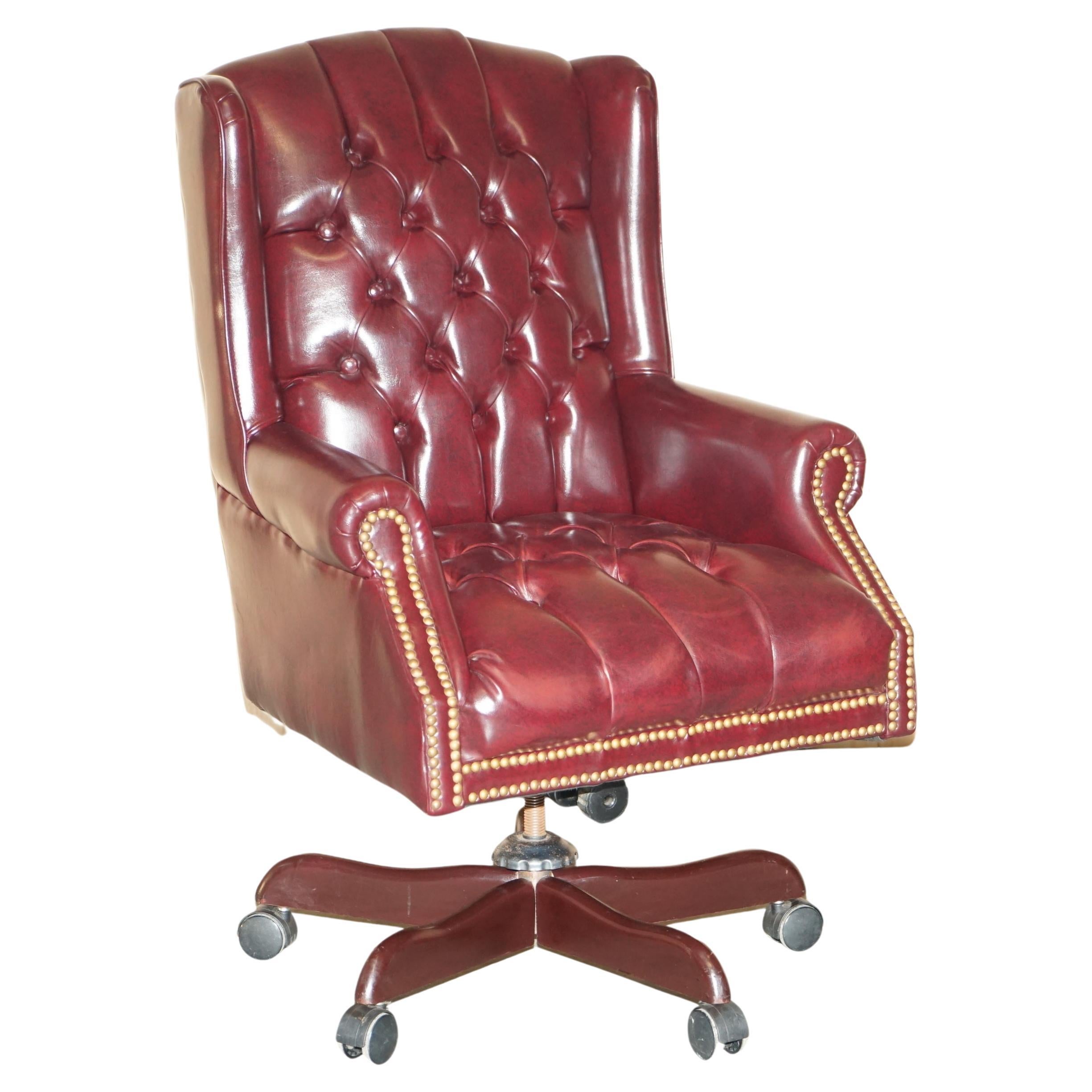 Vintage Oxblood Leather Antique Stud Chesterfield Wingback Swivel Office Chair For Sale