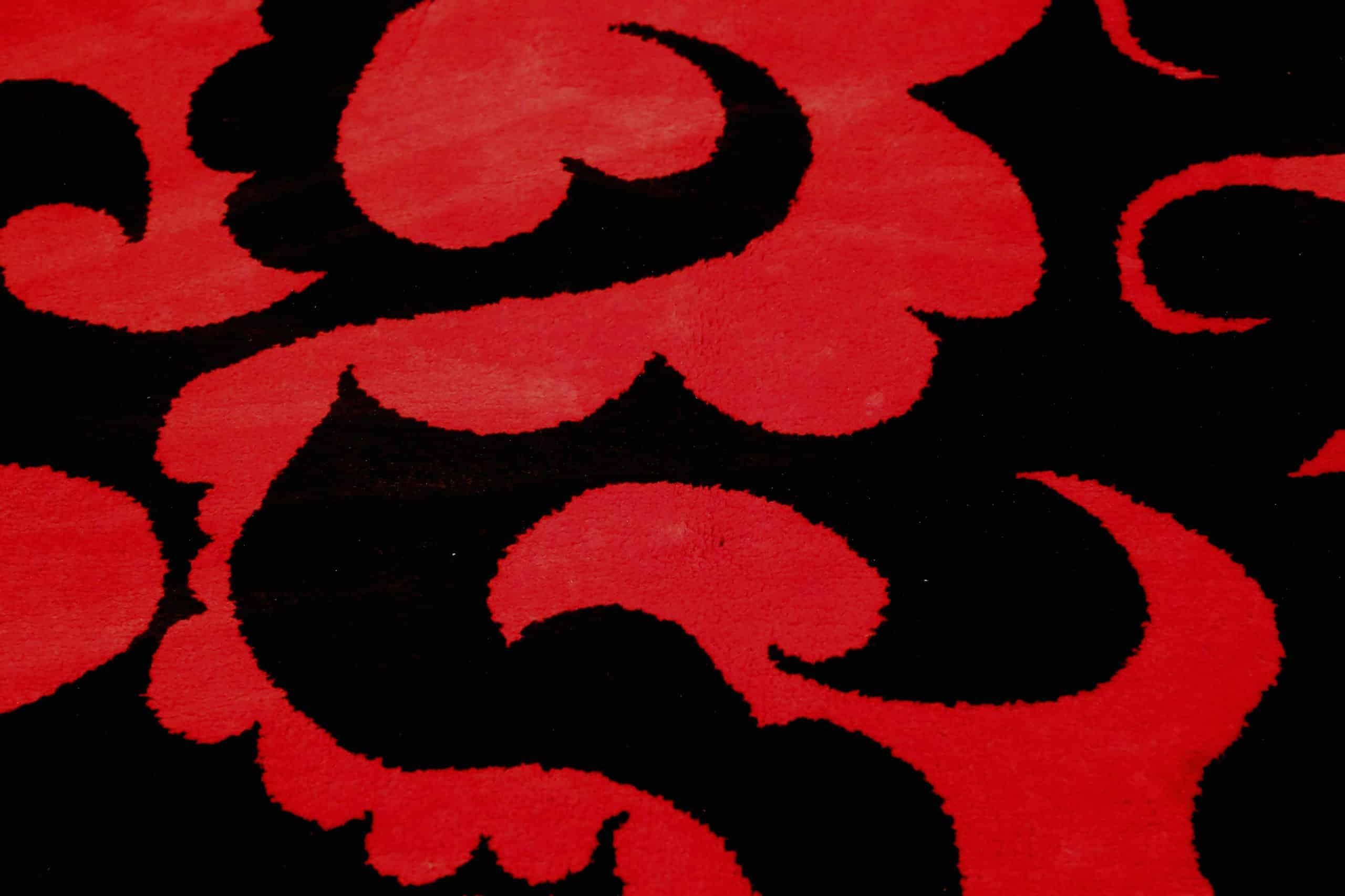 Vintage Red And Black Pablo Picasso Design Rug, Country of Origin: India, Circa date: Mid-Twentieth Century. Size: 6 ft 4 in x 8 ft 3 in (1.93 m x 2.51 m)

