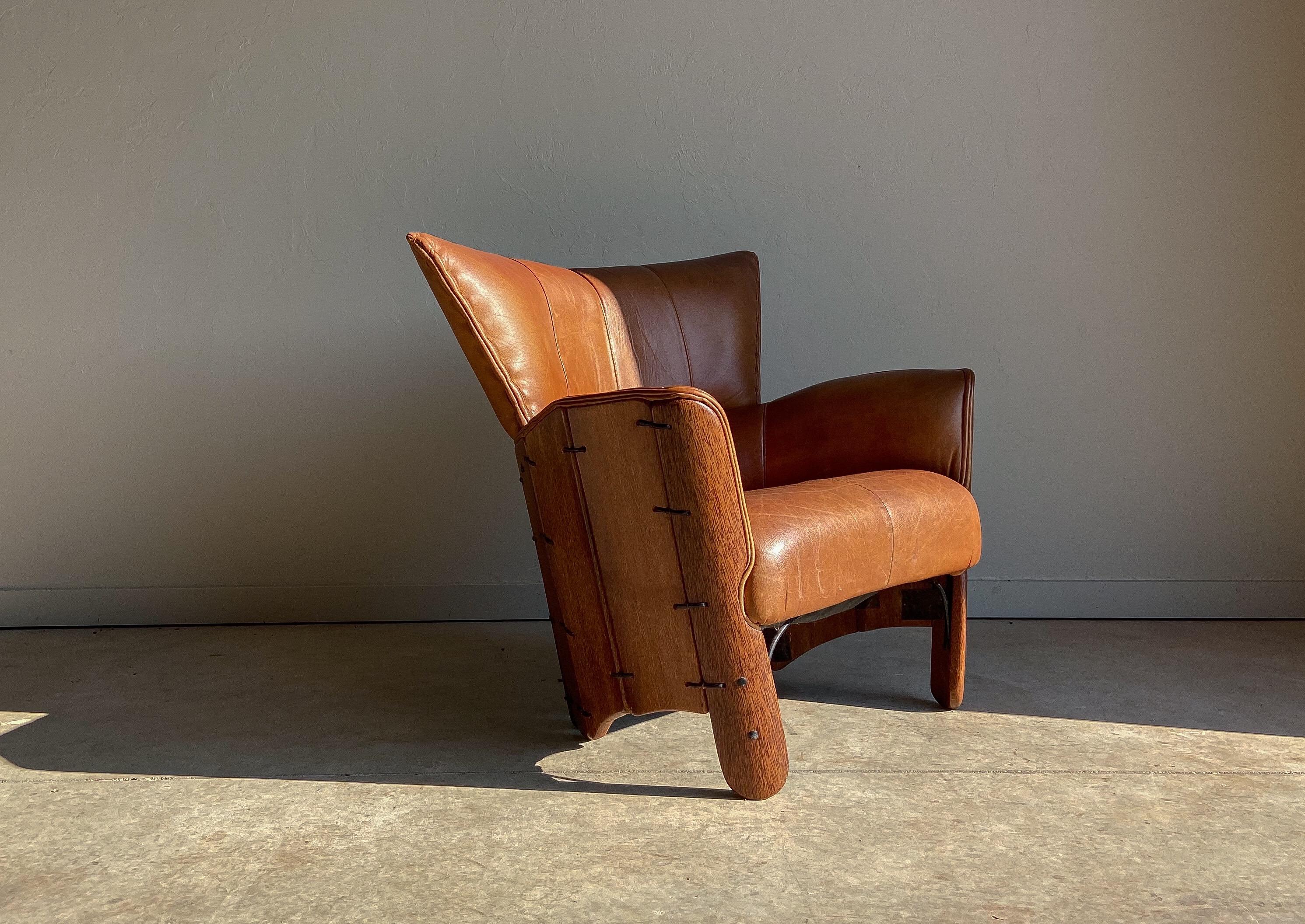 A wonderful and unique leather lounge chair by Pacific Green. Pacific Green is known for using sustainable top grade materials and expert craftsmanship. 

This chair is quite comfortable and has a wonderful patina that will only get better with age.