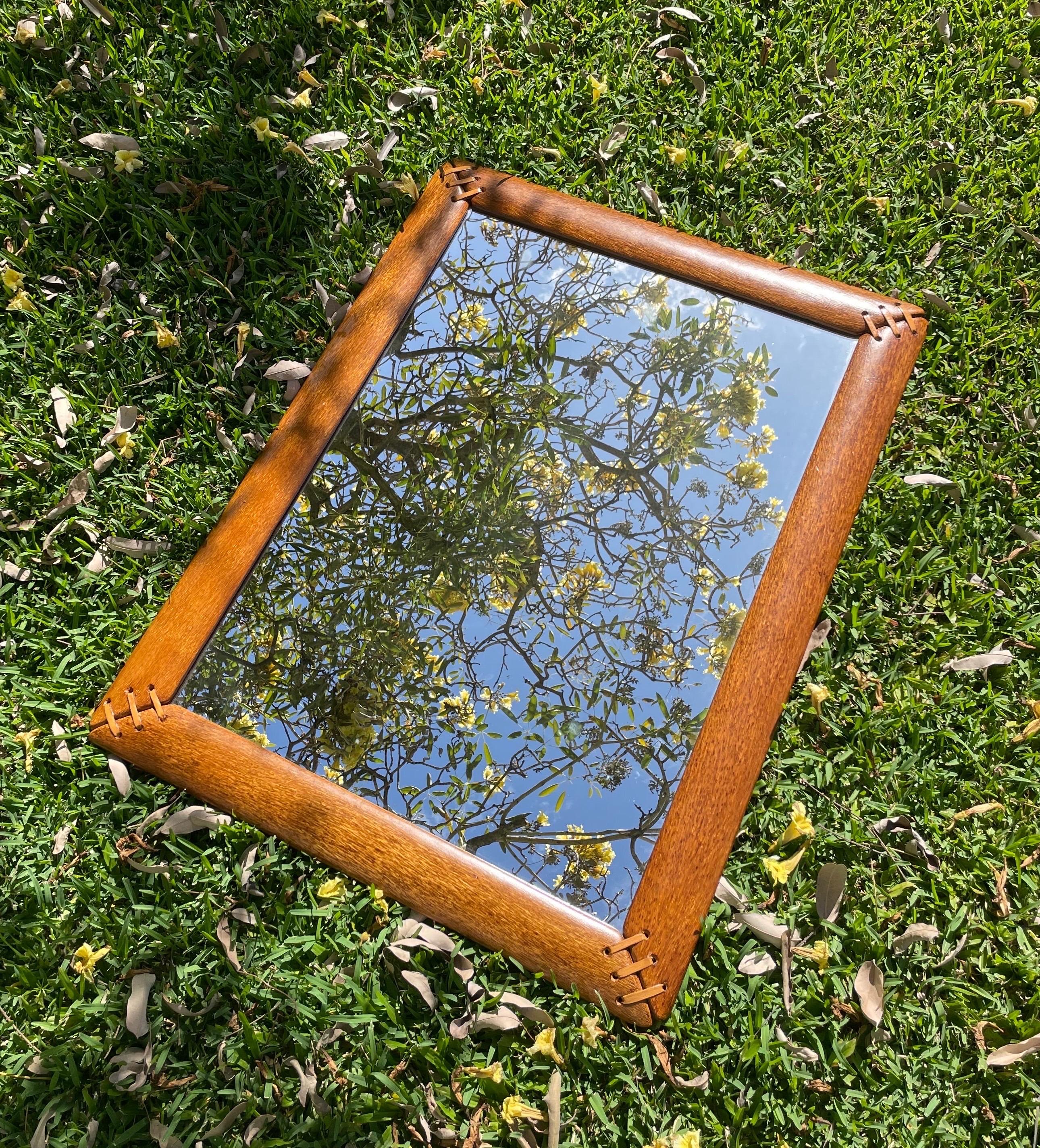 A palmwood and leather mirror by Pacific Green of Australia. Configured to hang vertically or horizontally.

Available for pick up in Kaneohe, HI (Oahu). Free delivery anywhere on the island is available for certain dates in November. 