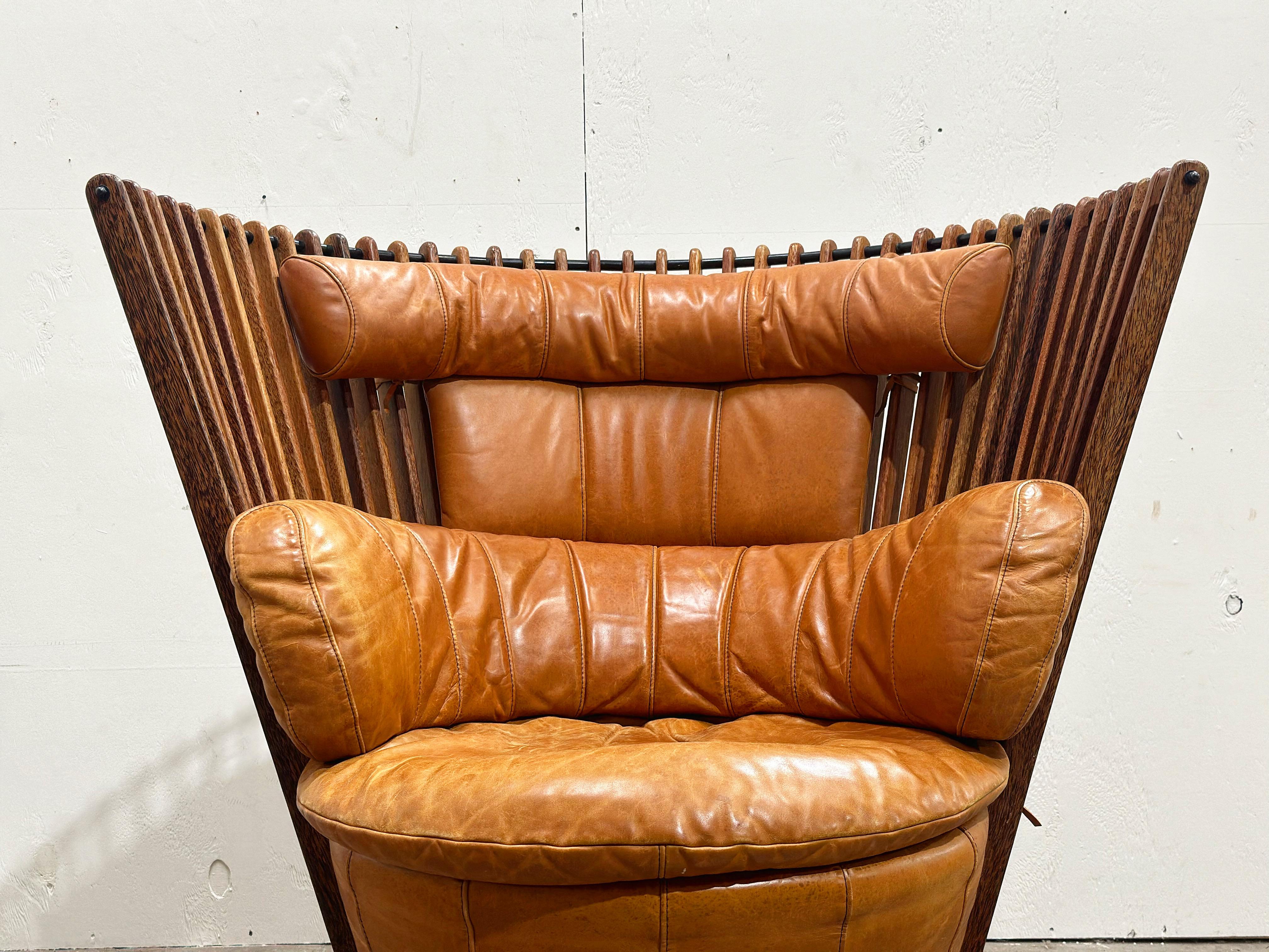 Vintage Pacific Green swivel lounge chair in cognac leather. An exceptional vintage rendition of the Tavarua collection, circa mid 1990s. Handcrafted by with full grain leather, palmwood and natural fibers. Exceptional quality and craftsmanship,