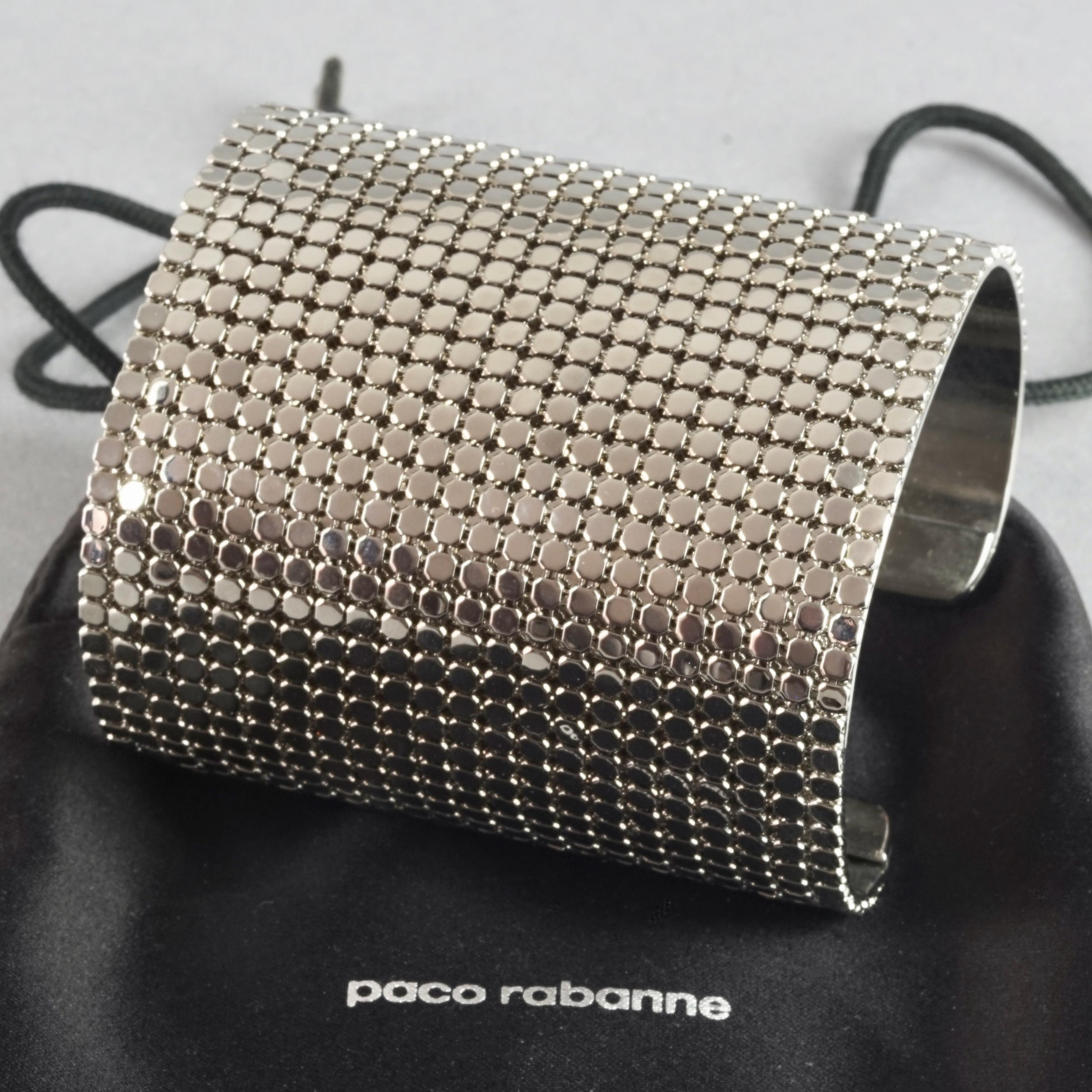 Vintage PACO RABANNE Disco Mesh Cuff Bracelet 	

Measurements:
Height: 2.75 inches (7 cm)
Length: 6.53 inches (16.6 cm) including opening

Features:
- 100% Authentic PACO RABANNE.
- Metal disco mesh wide cuff bracelet.
- Signed PACO RABANNE.
-