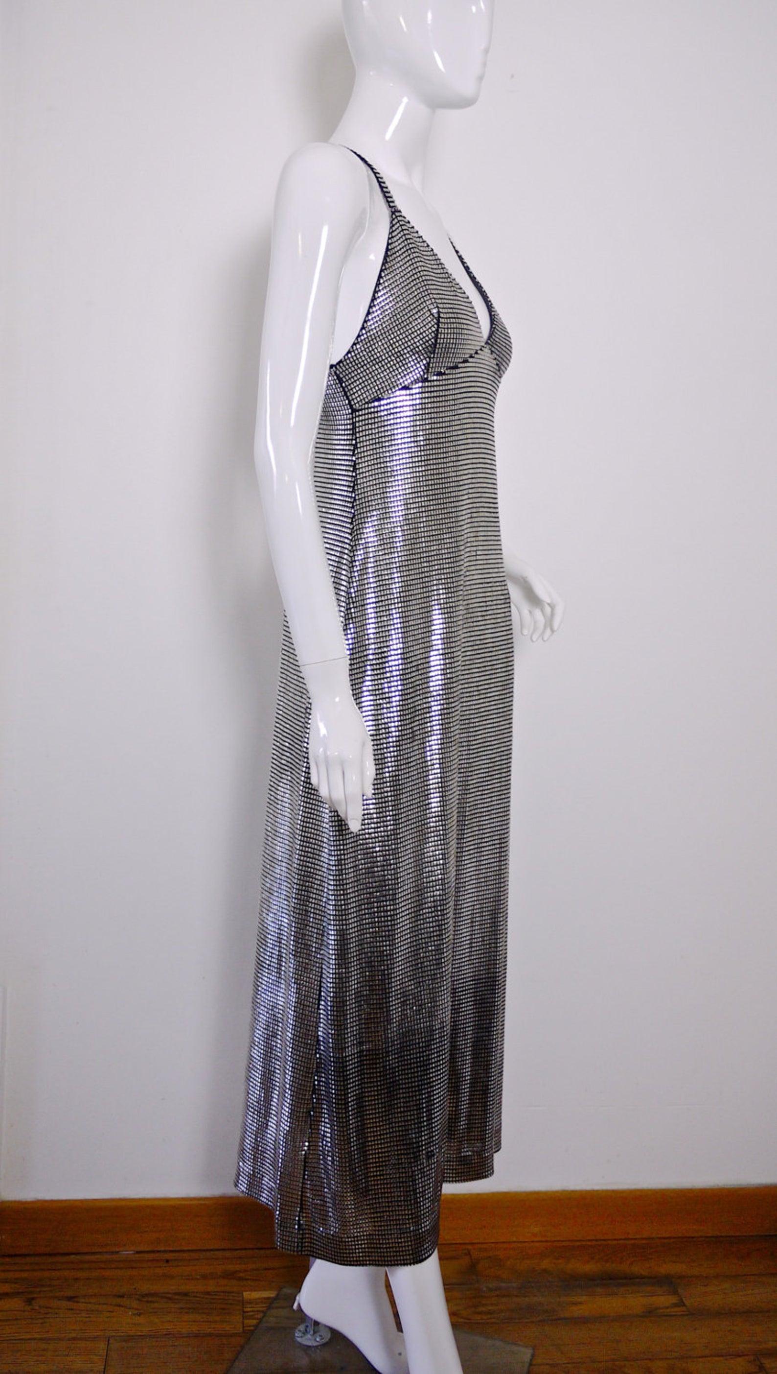 Vintage PACO RABANNE Silver Metallic Mesh Grid Long Dress

Measurements taken laid flat, please double bust and waist:
Bust: 14 inches (35.56 cm) could accommodate bigger size as it is open back dress
Waist: 14 inches (35.56 cm) without