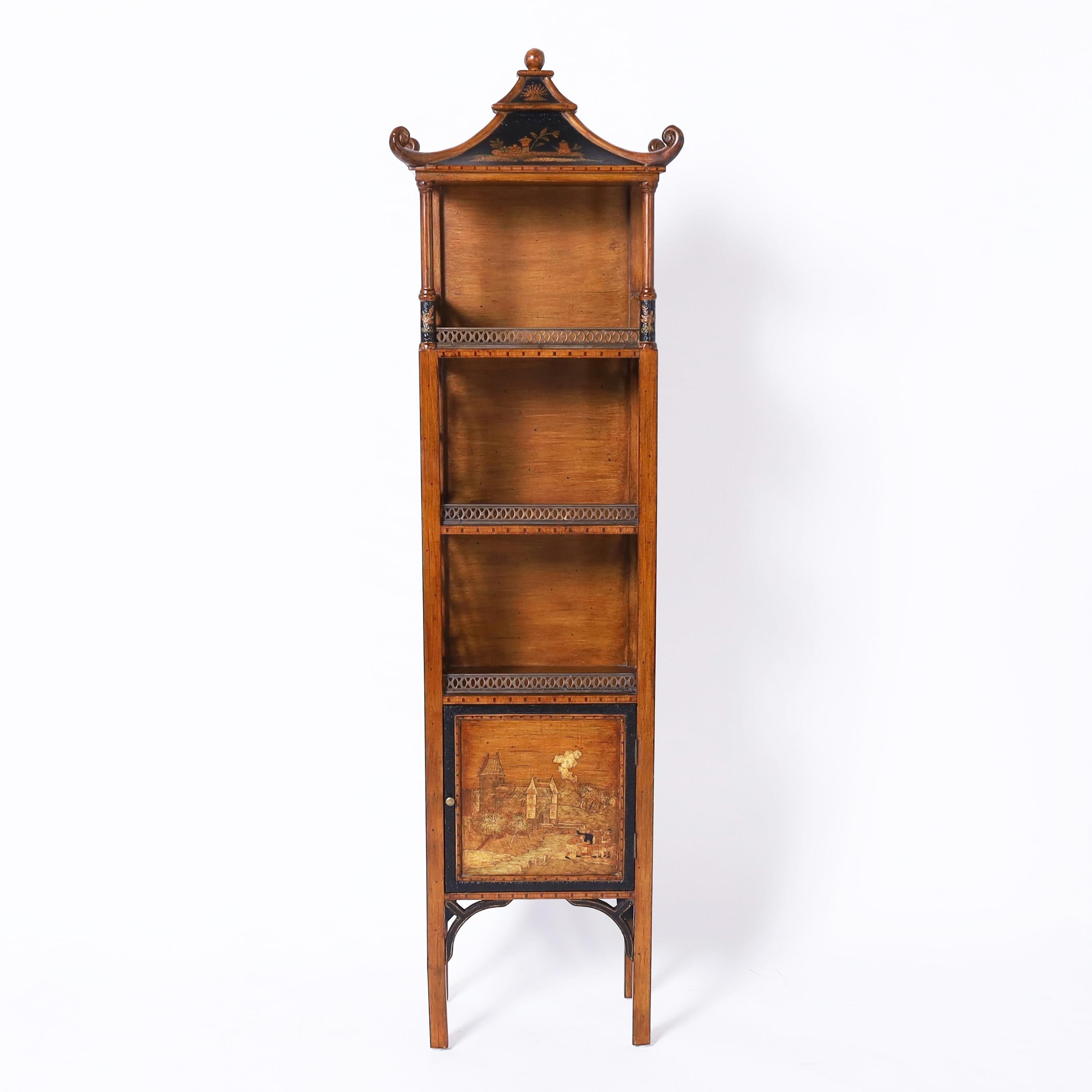 Enchanting vintage etagere crafted in hardwood with painted grain featuring a pagoda top over three shelves with brass galleries and Chinese Chippendale sides on a cabinet with hand painted chinoiserie and ming style legs.