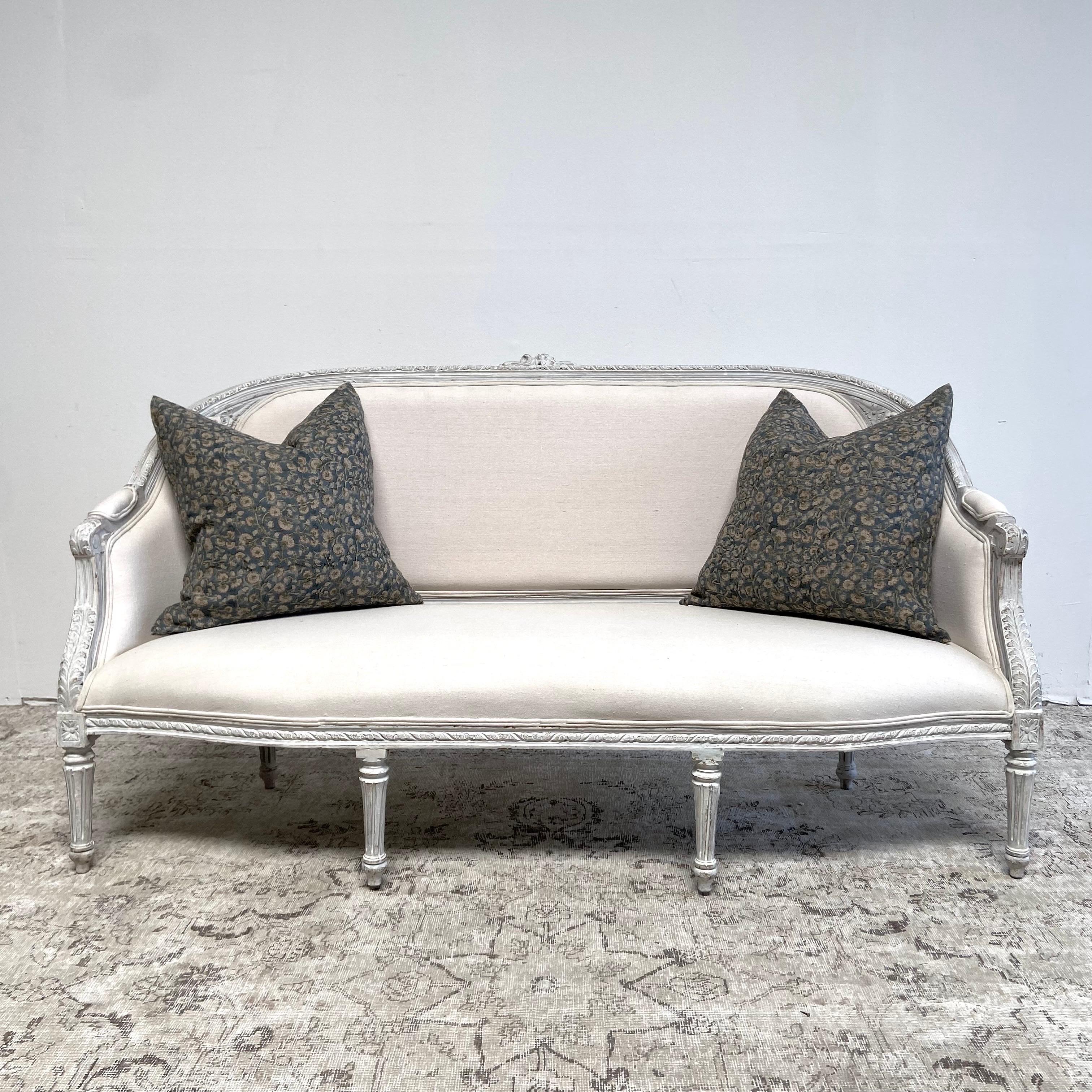 Painted and Upholstered French Style Settee.
Sturdy ready for everyday use. Can be reupholstered for an additional fee.
French gray paint with distressed finish, and antique patina.
Louis XVI style fluted legs with Classic fluerettes, and rose