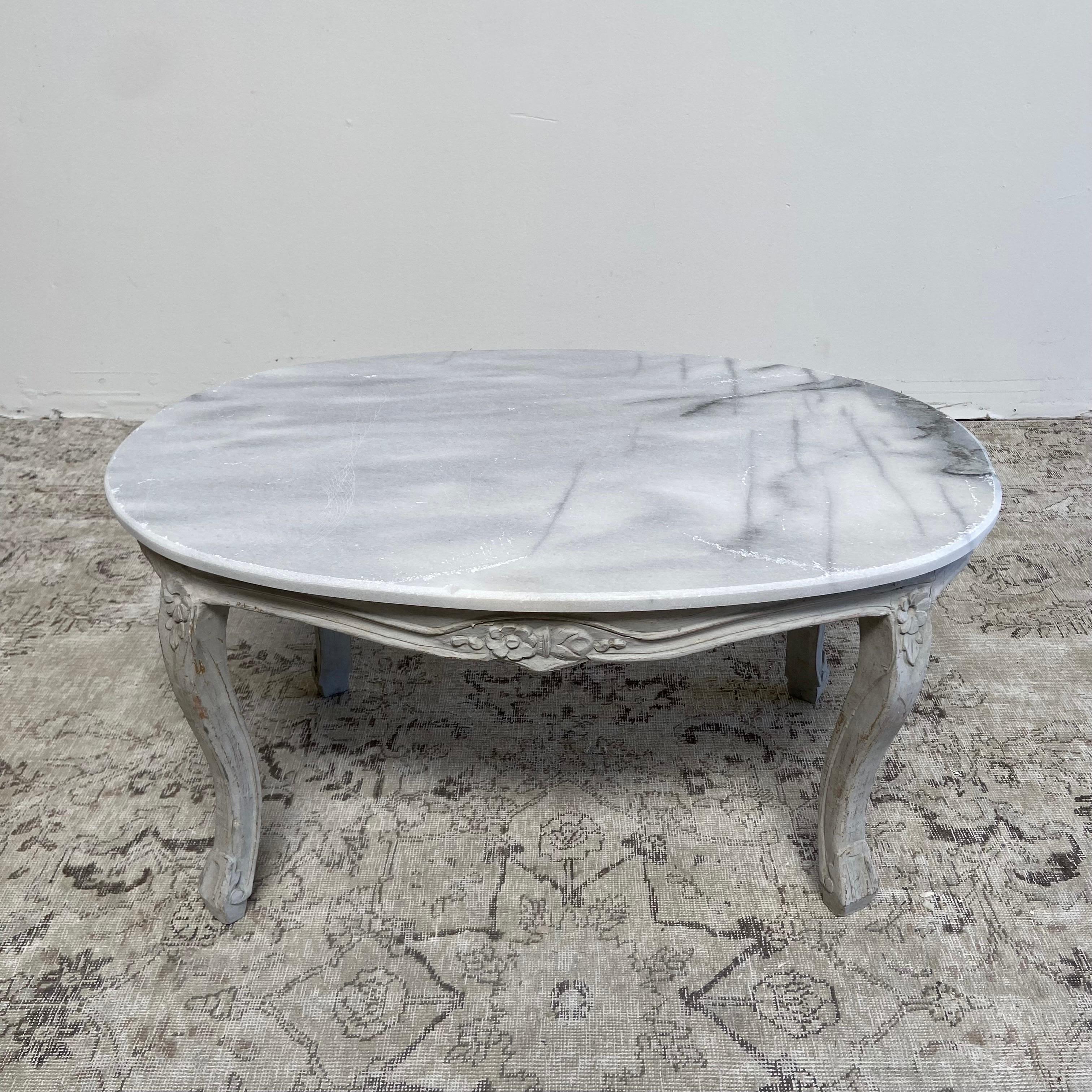 Vintage French style marble top coffee table.
Painted in a gustavian grey color, with subtle distressed edges and antique patina.
Legs are solid and sturdy, marble is not attached to the base.
Size: 35”W x 22”D x 18-1/2”H
Marble is a straight