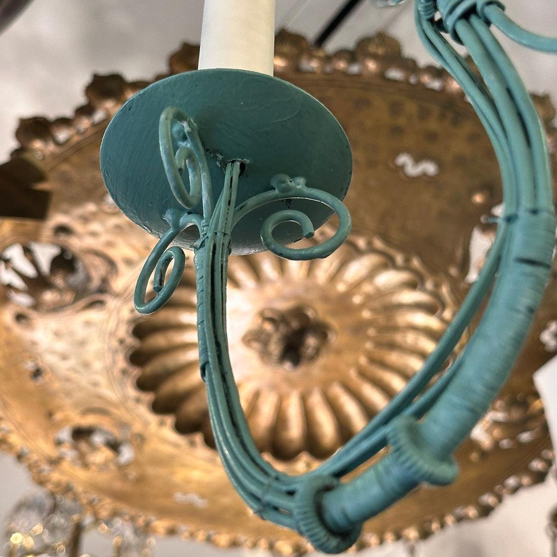 A French circa 1950's painted iron chandelier with 8 lights.

Measurements:
Height: 34