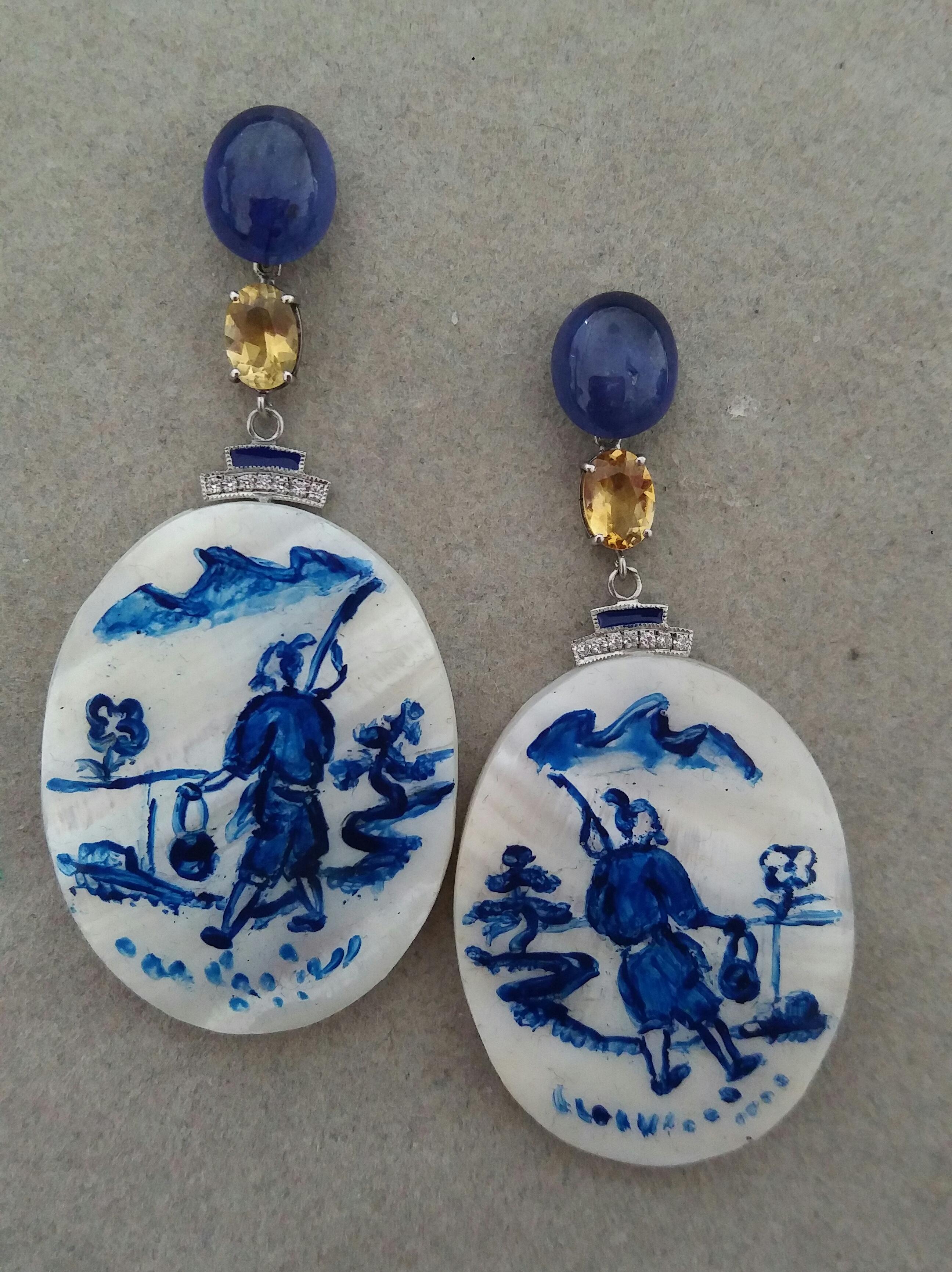 Vintage pair of oval shape hand painted Mother of Pearl 30 mm x 40 mm, depicting a chinese fisherman walking near the river ,suspended from 2 oval Blue Sapphire cabochons size 8x10 mm ,in the middle we have 2 oval  Faceted Citrines and 2 white gold
