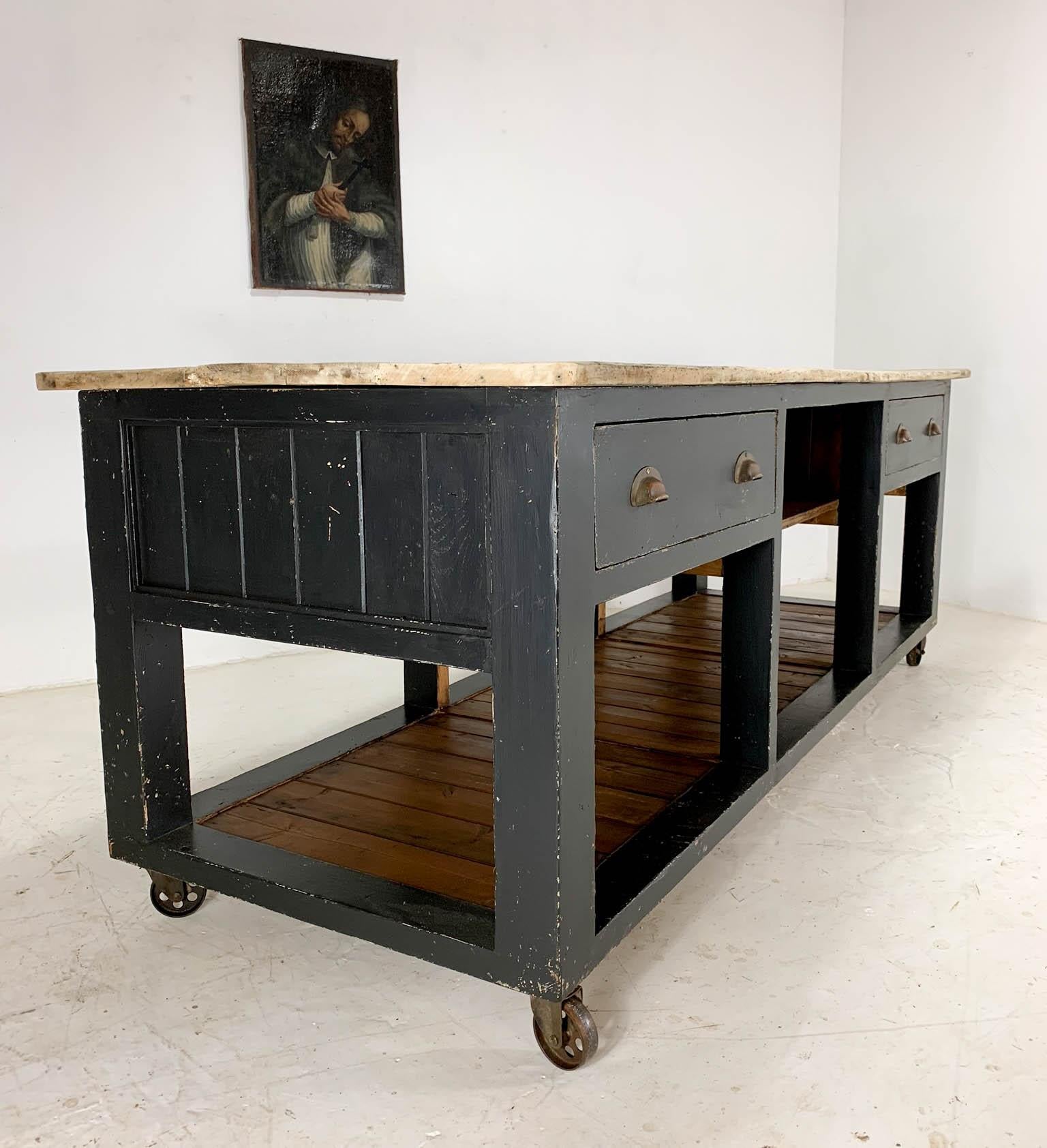 Vintage Baker's table dating from the 1940s, which was part of a clearance we did on an old bakery in Carmarthen- this one was found in an outhouse. The frame has been heavily restored, painted black and distressed. It retains the original sycamore