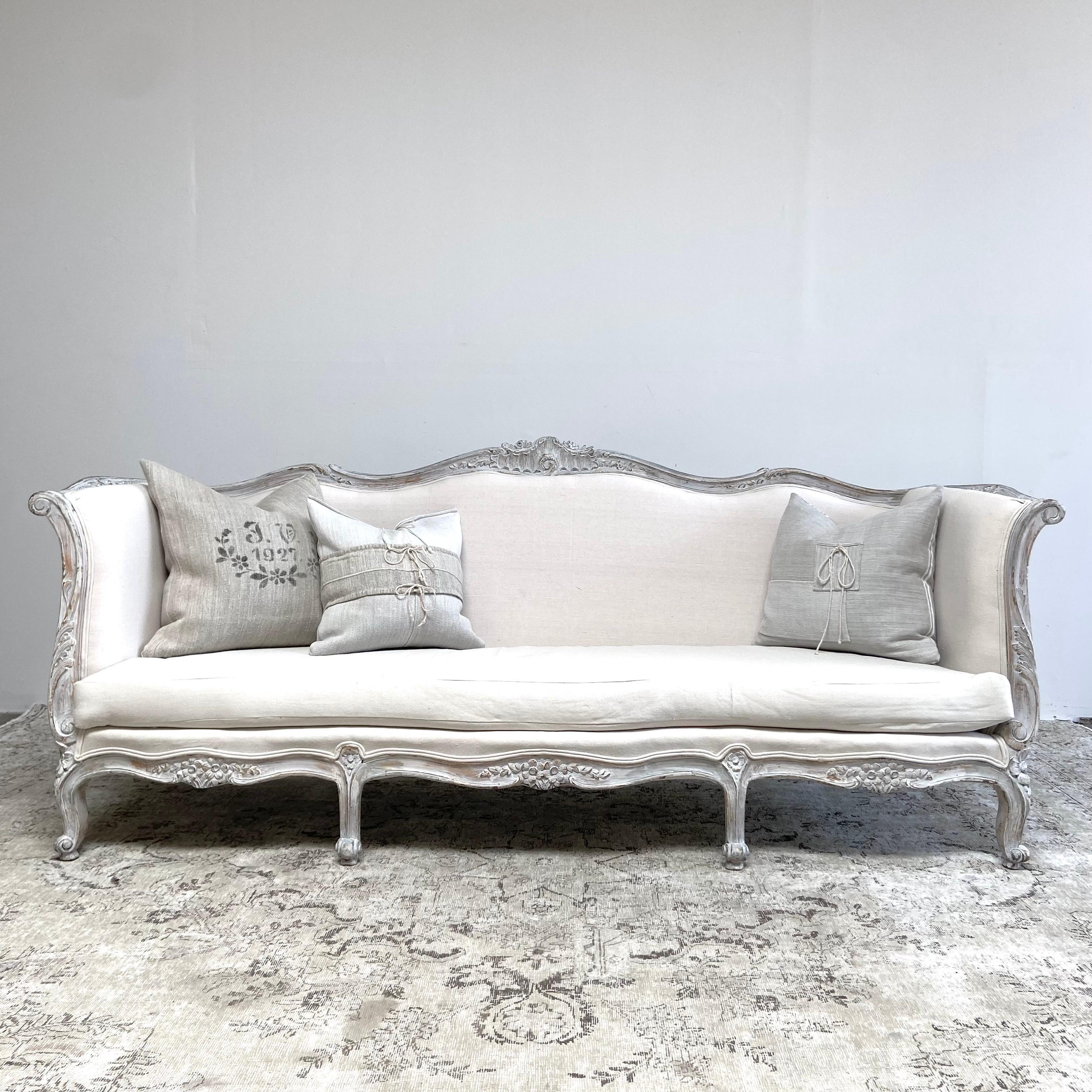 Vintage sofa 90”L x 30”D x 37”H
SH: 16”. SD:22”. AH:31”
This painted french style sofa is upholstered in a standard muslin, can be reupholstered in any of our linens, or your own material.
Frame is painted in a gustavian grey with subtle