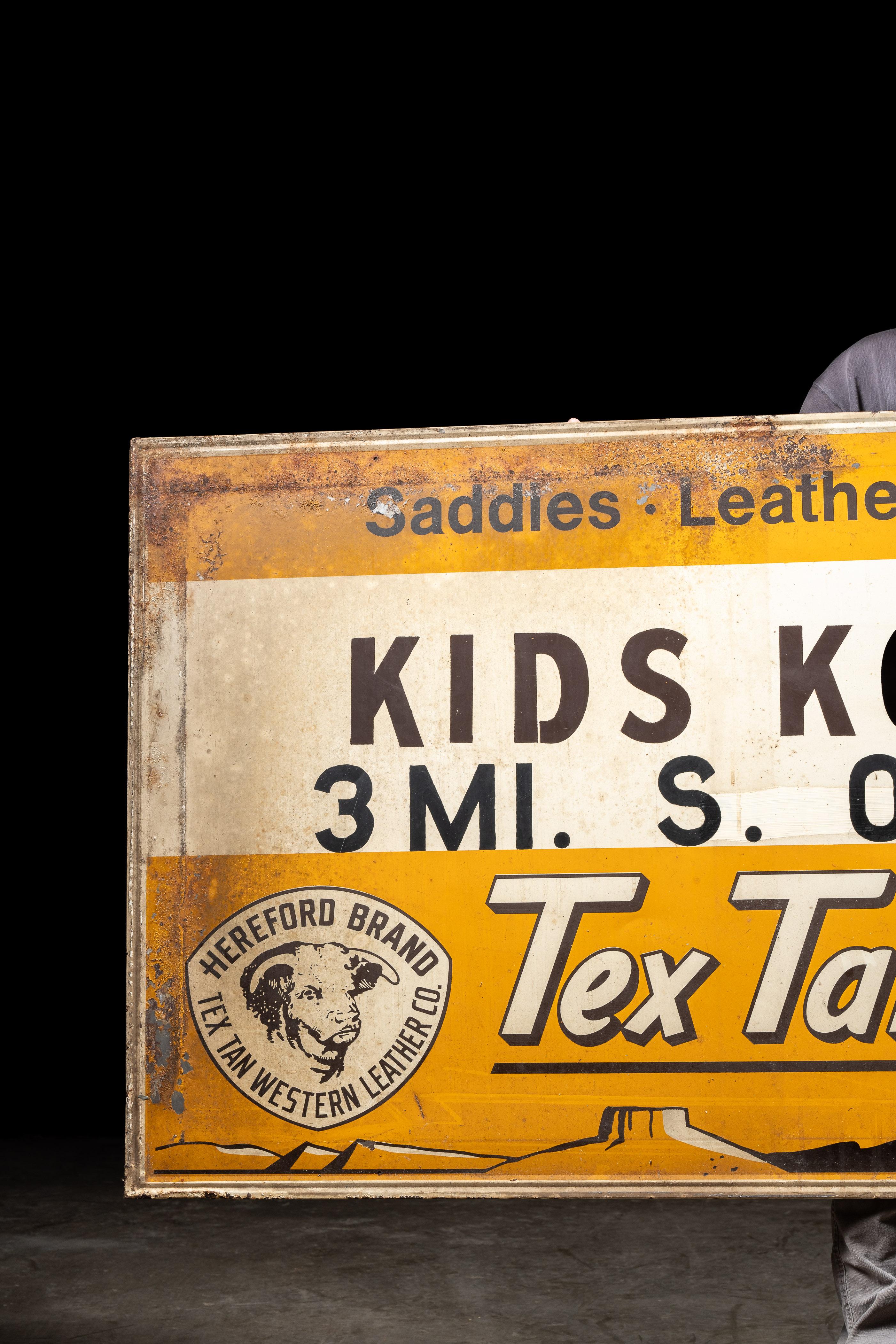 c. 1950s/1960s; Kids Korral, Inc. - Lakeville, IN and Tex-Tan Western Leather Co. - Yoakum, TX

Vintage painted tin children's western wear sign.

This sign advertises Tex Tan leather goods for children, sold through Kids Korral, a northwestern