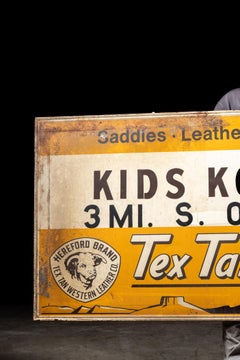 Vintage Painted Tin Tex Tan Western Wear Sign