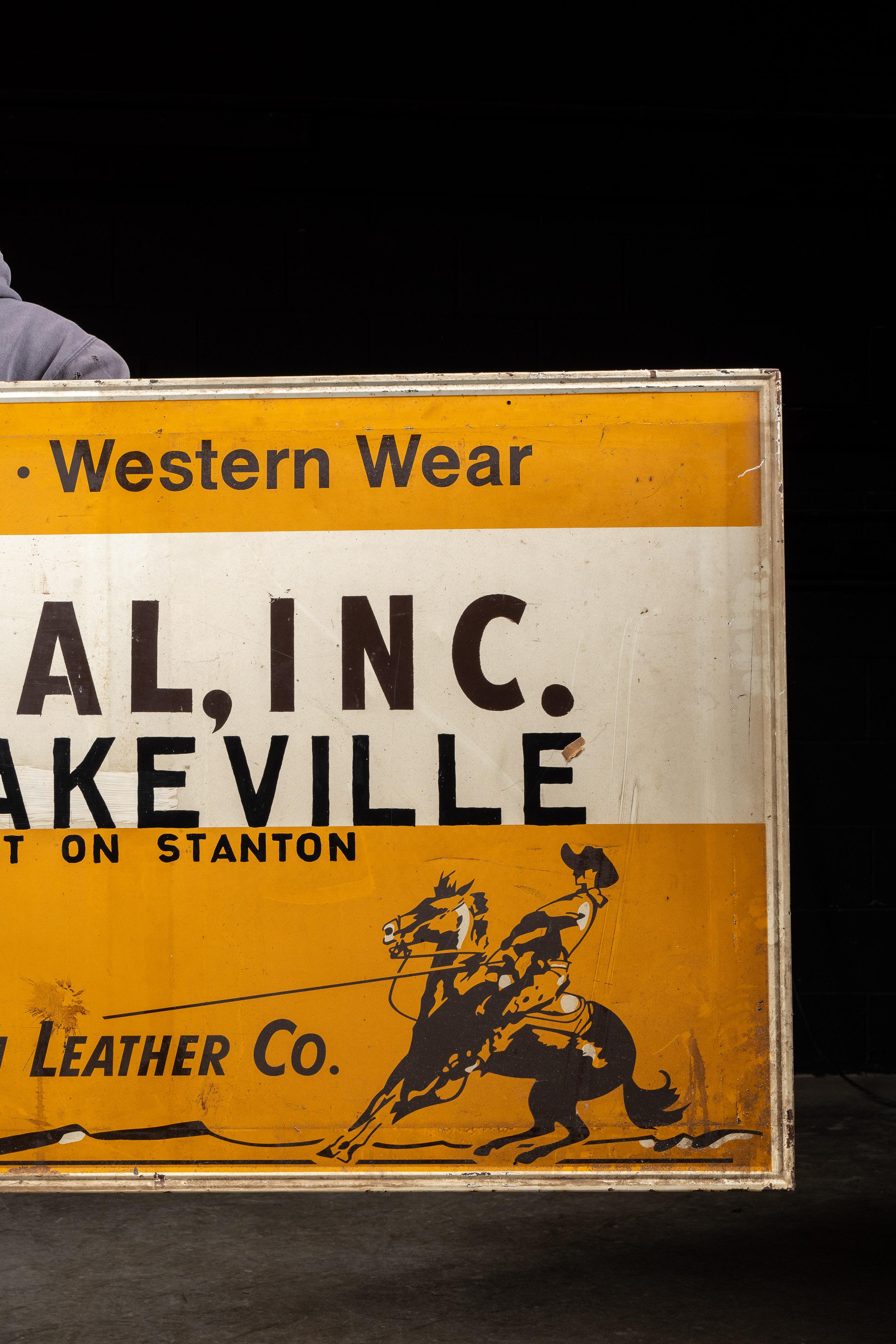 Vintage Painted Tin Tex Tan Western Wear Sign In Distressed Condition For Sale In Dekalb, IL